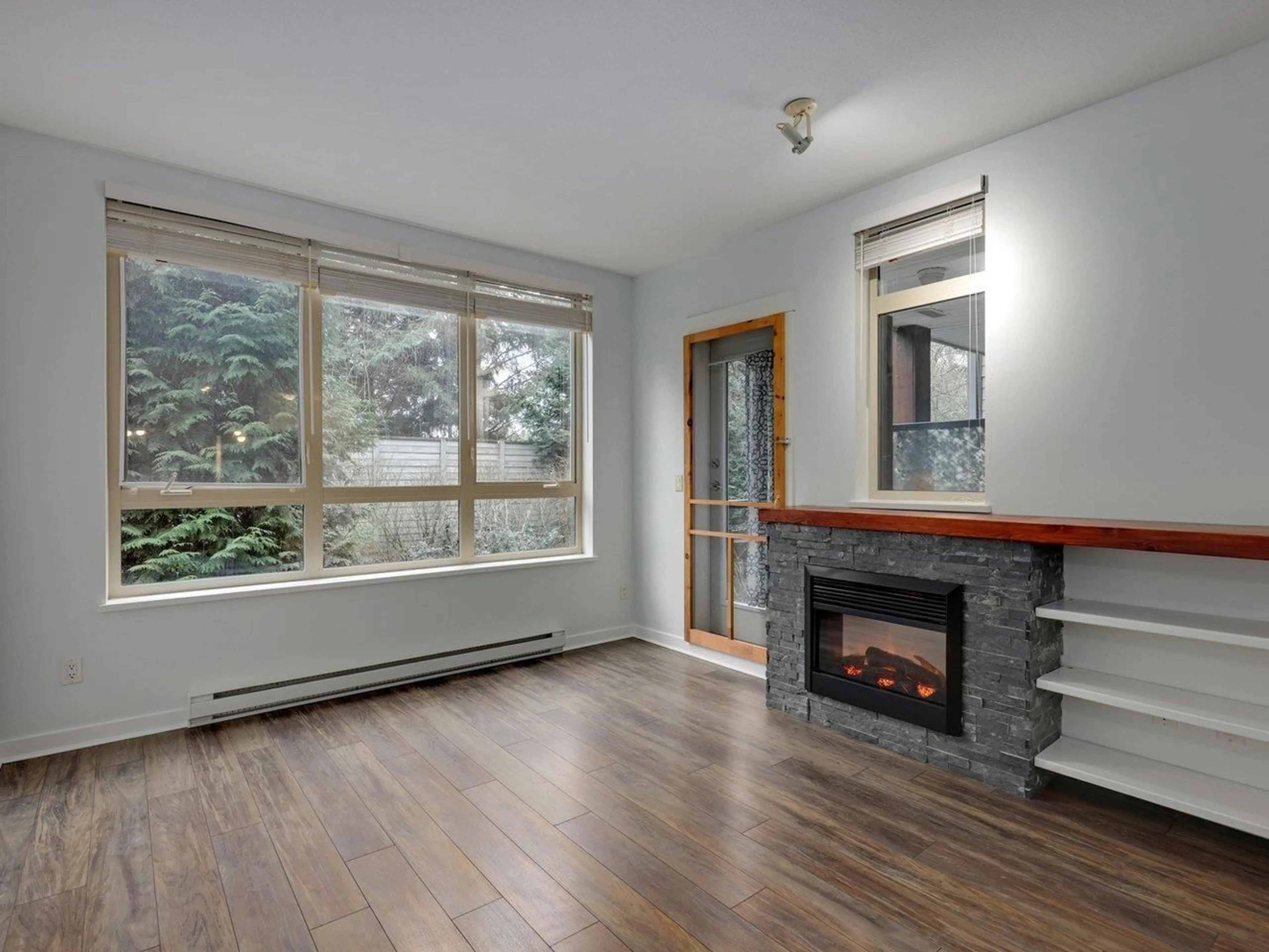 Living room with furniture, wood/laminate floor for 224 - 15918 26 AVENUE, Surrey British Columbia V3S5K3