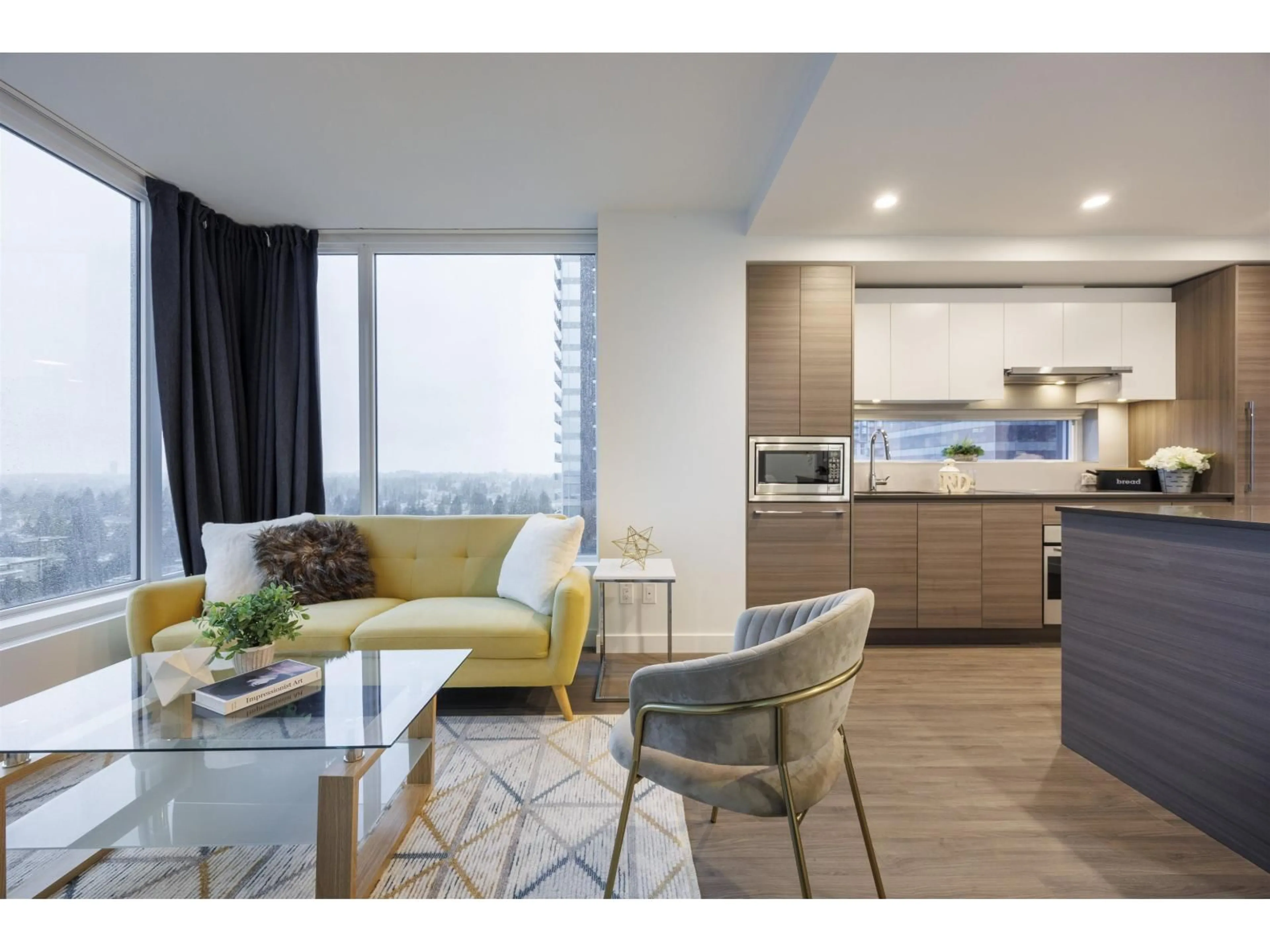 Living room with furniture, wood/laminate floor for 1603 - 13655 FRASER HIGHWAY, Surrey British Columbia V3T0P8