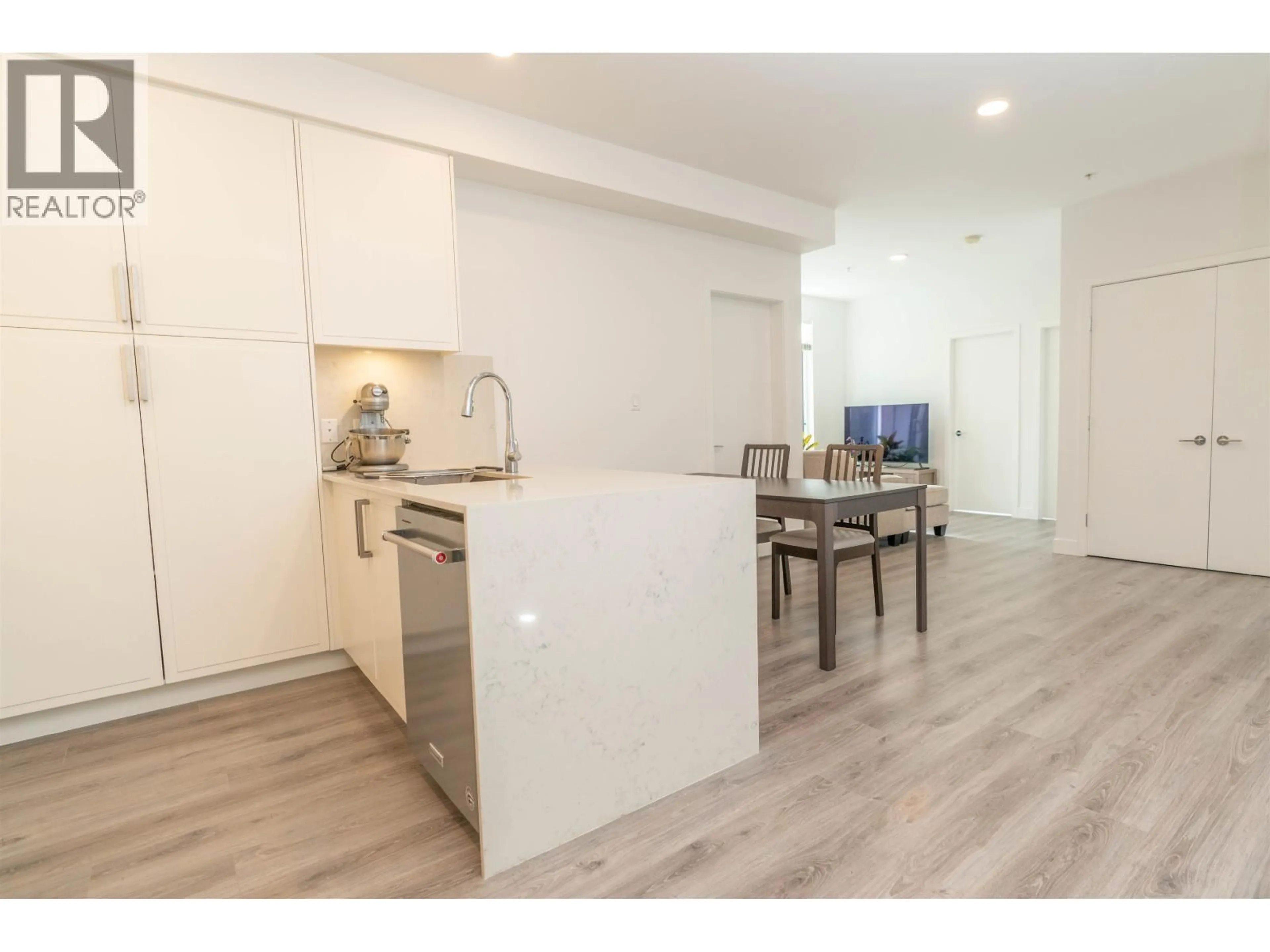 Open concept kitchen, wood/laminate floor for 505 - 700 CLARKE ROAD, Coquitlam British Columbia V3J0K5