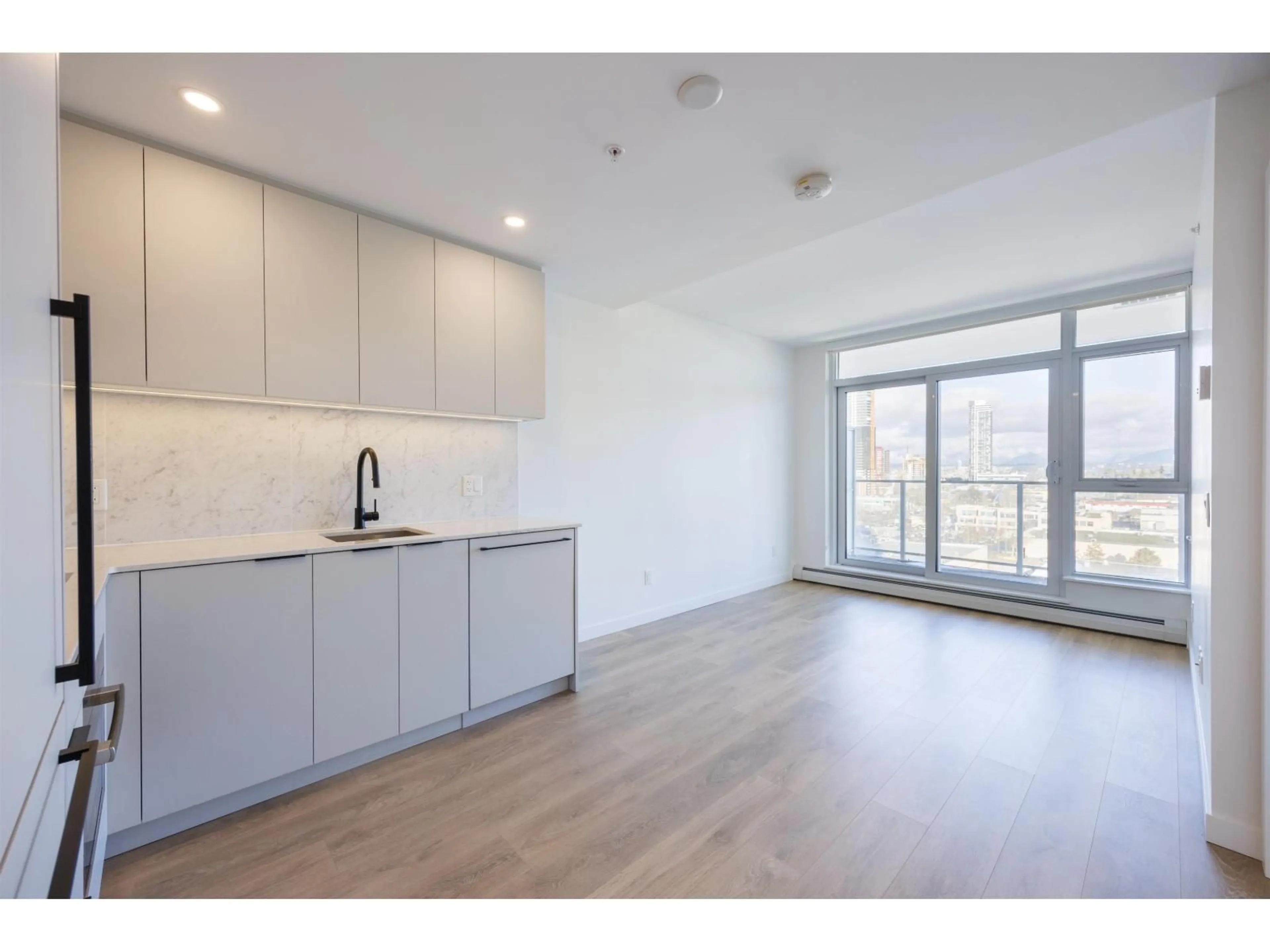 Open concept kitchen, wood/laminate floor for 1201 - 13685 102 AVENUE, Surrey British Columbia V3T1N7