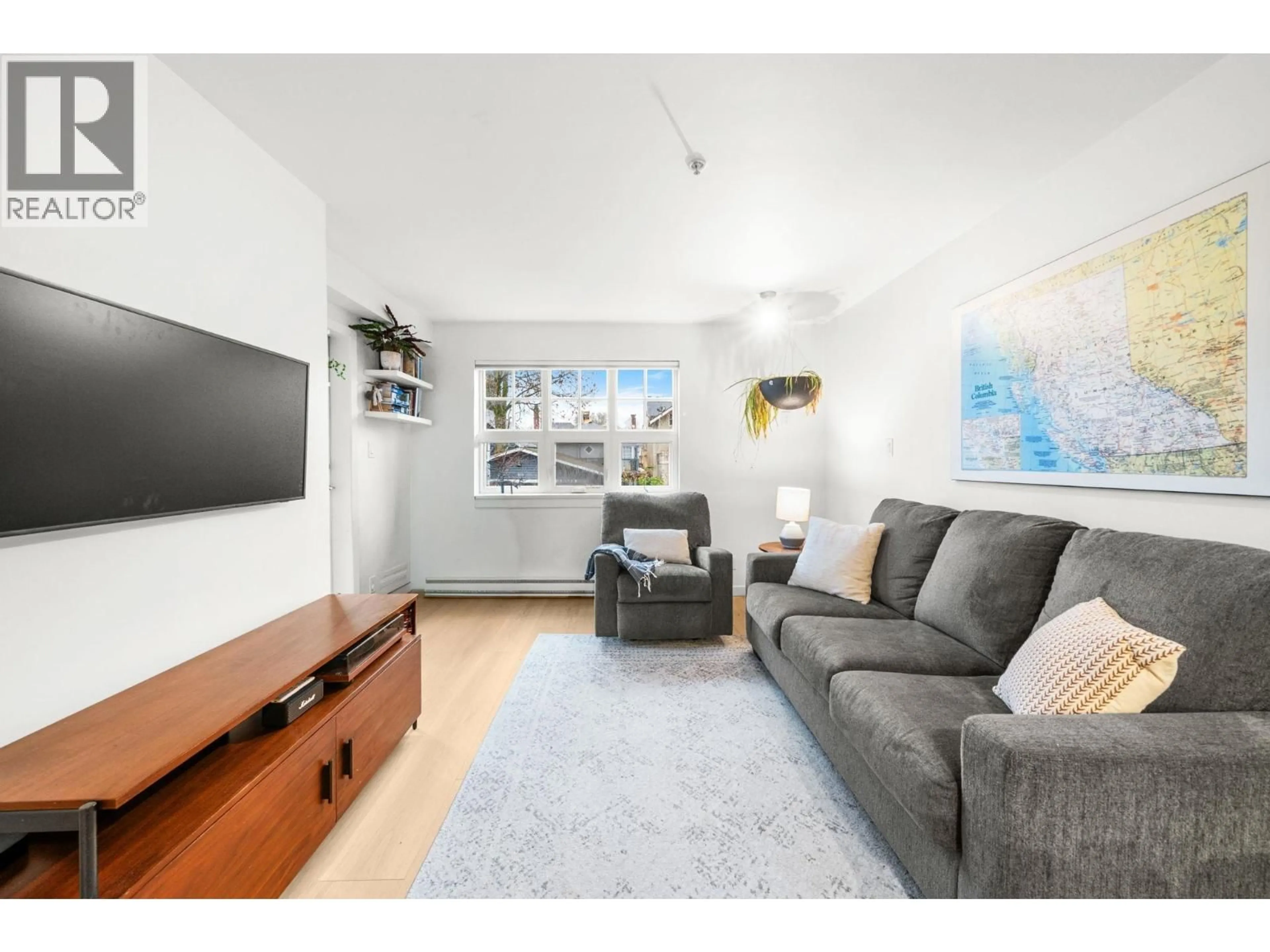 Living room with furniture, wood/laminate floor for 203 - 930 16TH AVENUE, Vancouver British Columbia V5Z1T2