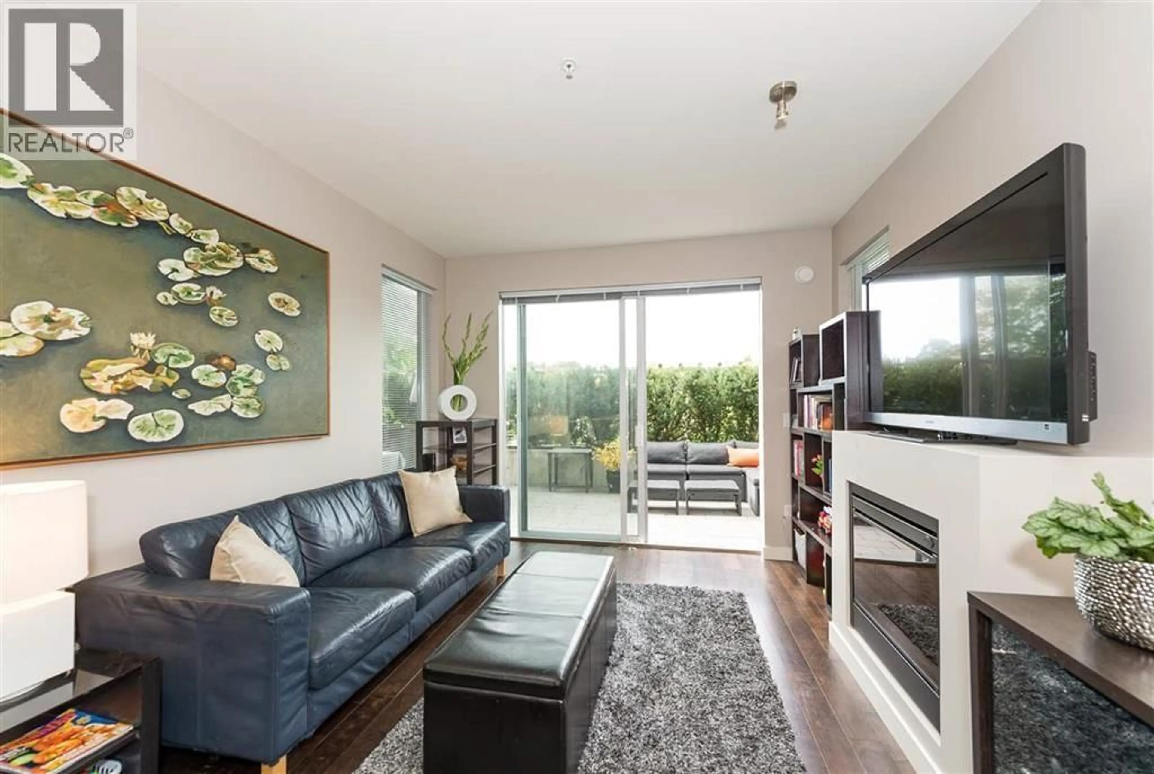 Living room with furniture, wood/laminate floor for 223 - 3333 MAIN STREET, Vancouver British Columbia V5V3M8