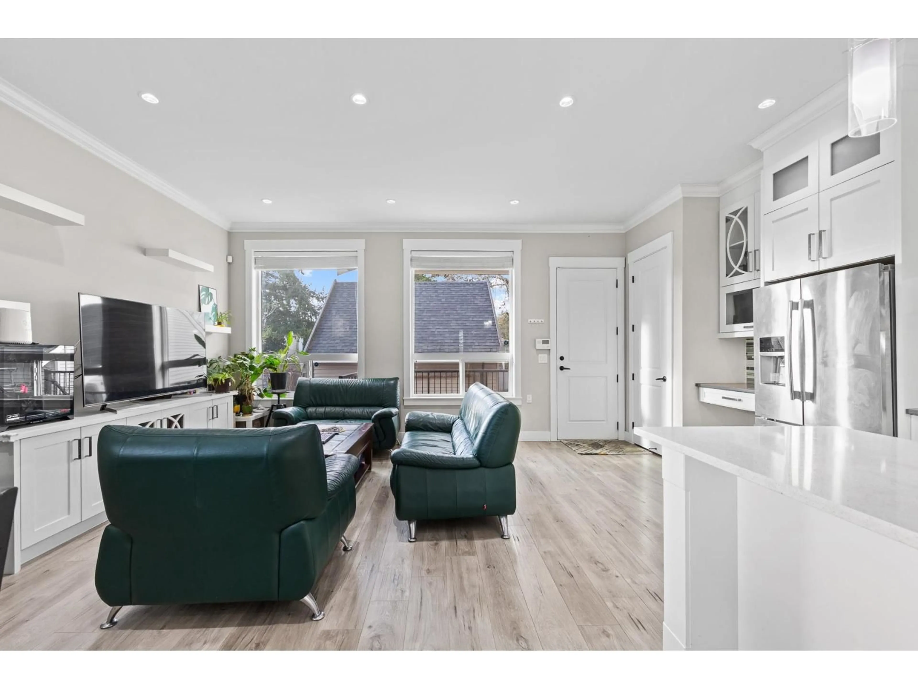 Living room with furniture, wood/laminate floor for 10579 132 STREET, Surrey British Columbia V3T3V5