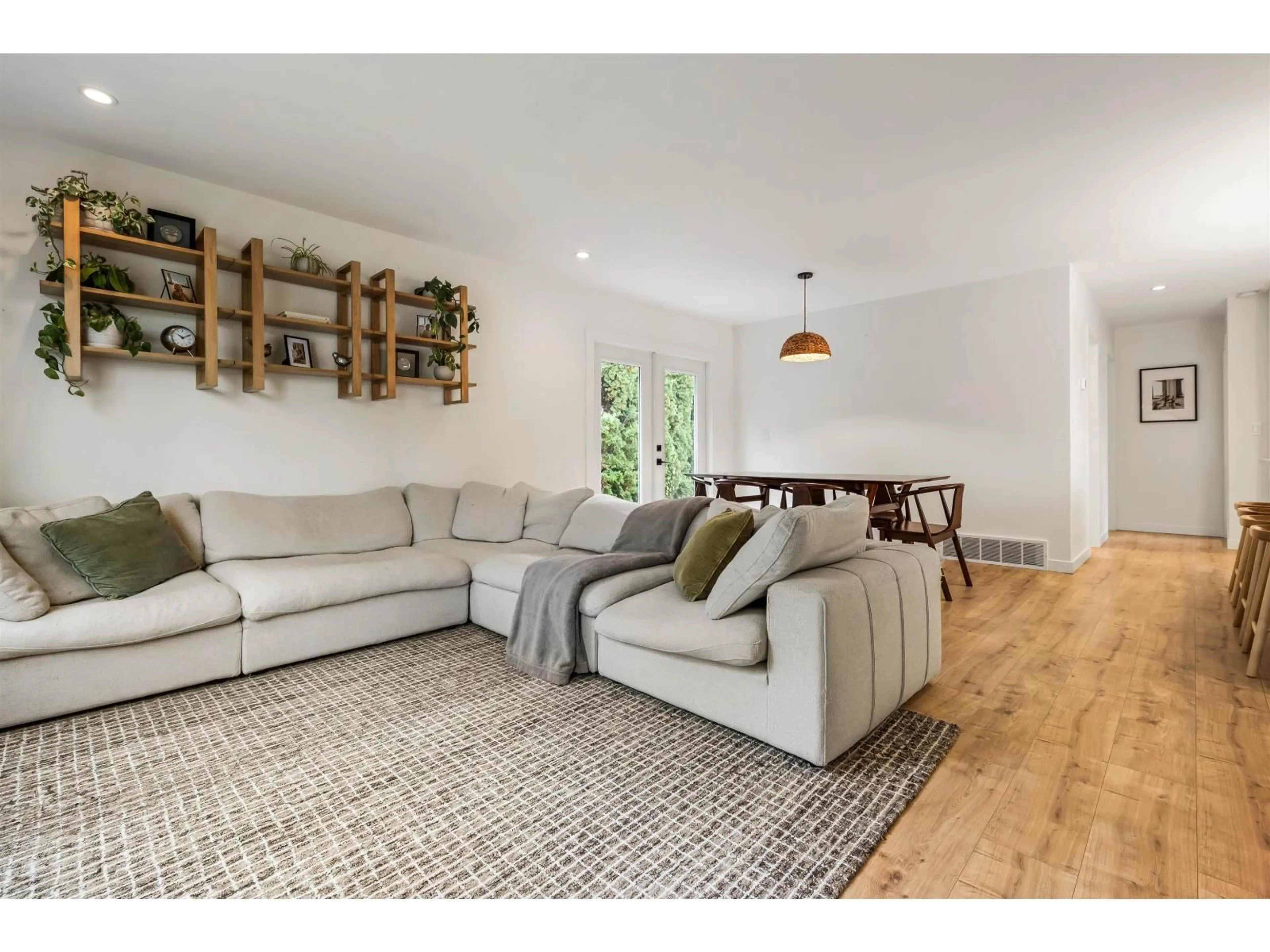 Living room with furniture, wood/laminate floor for 9046 BROADWAY STREET, Chilliwack British Columbia V2P5W1