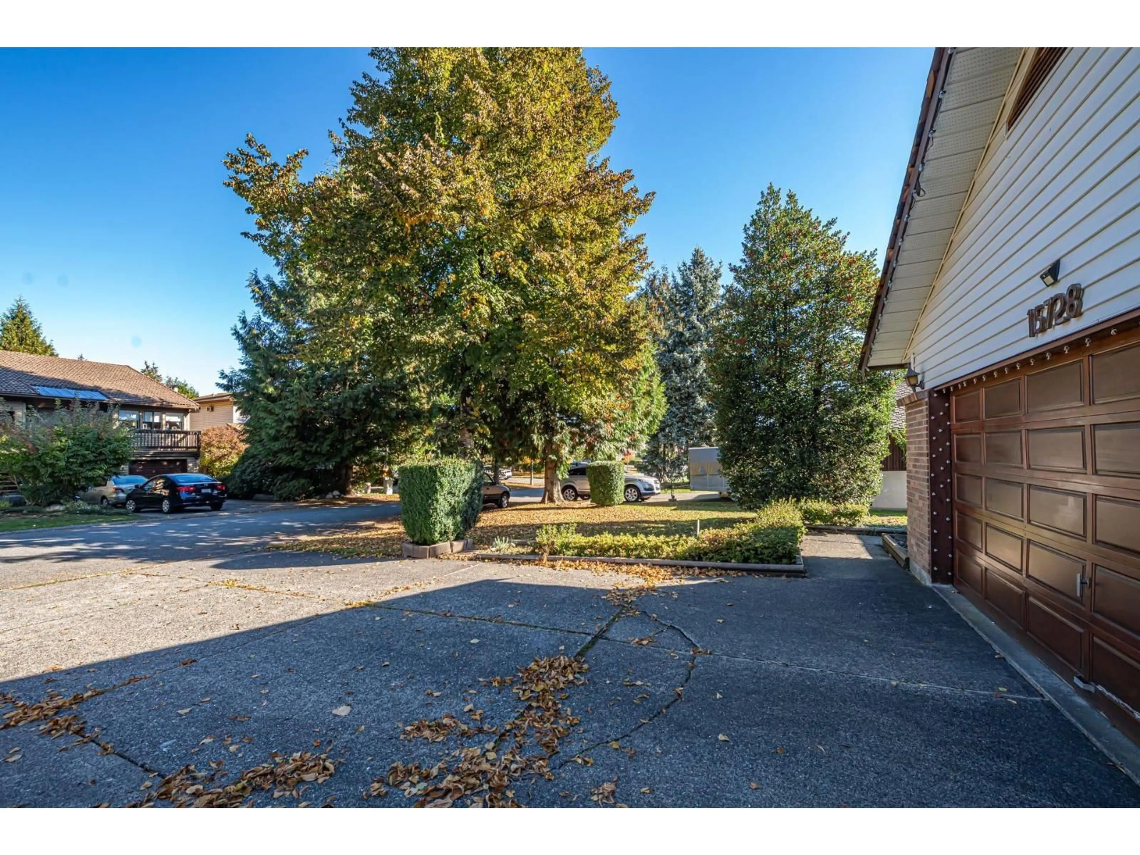 A pic from outside/outdoor area/front of a property/back of a property/a pic from drone, street for 15728 99A AVENUE, Surrey British Columbia V4N2A9