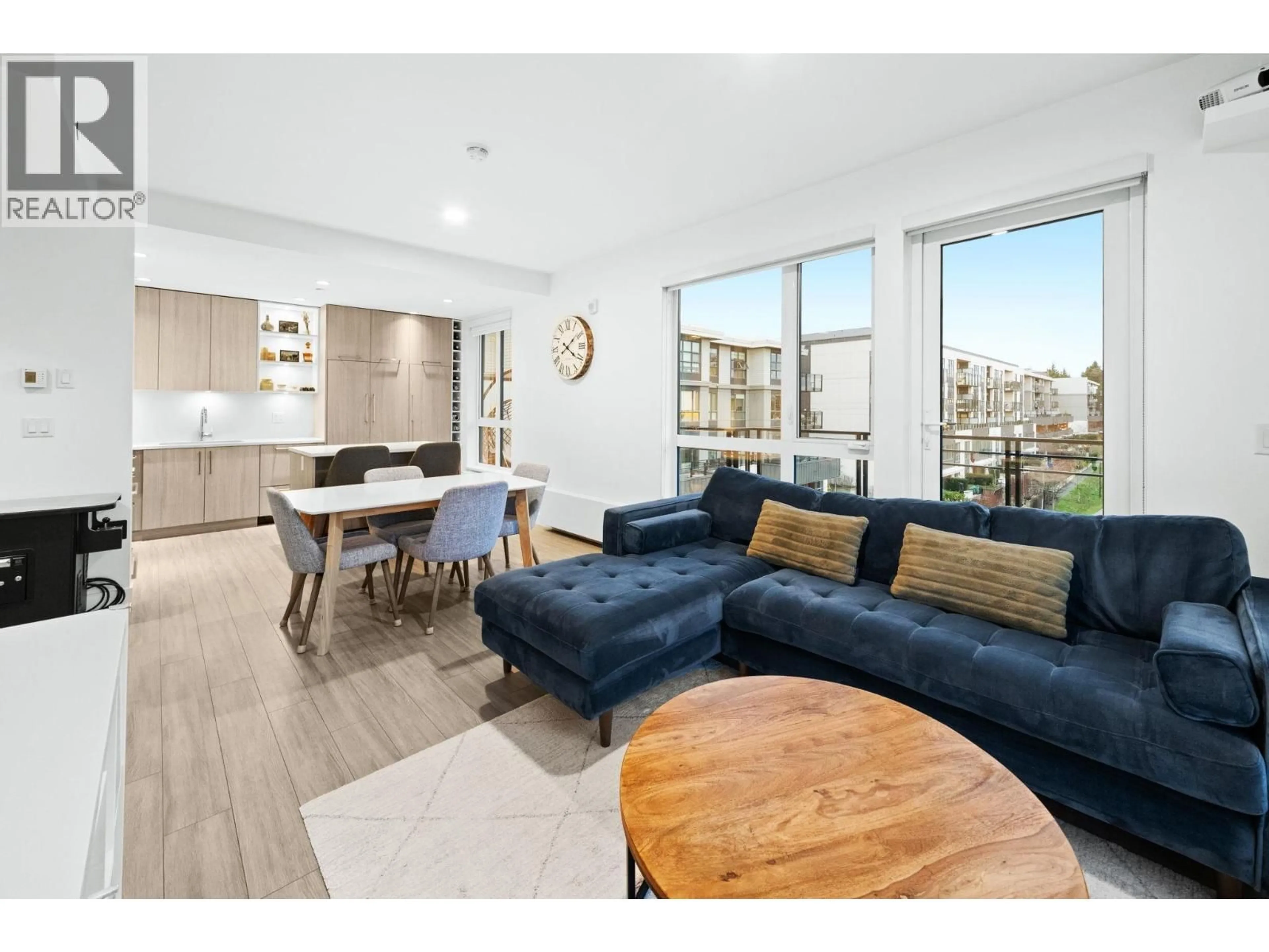 Living room with furniture, wood/laminate floor for 304 - 707 3RD STREET, North Vancouver British Columbia V7L1G8