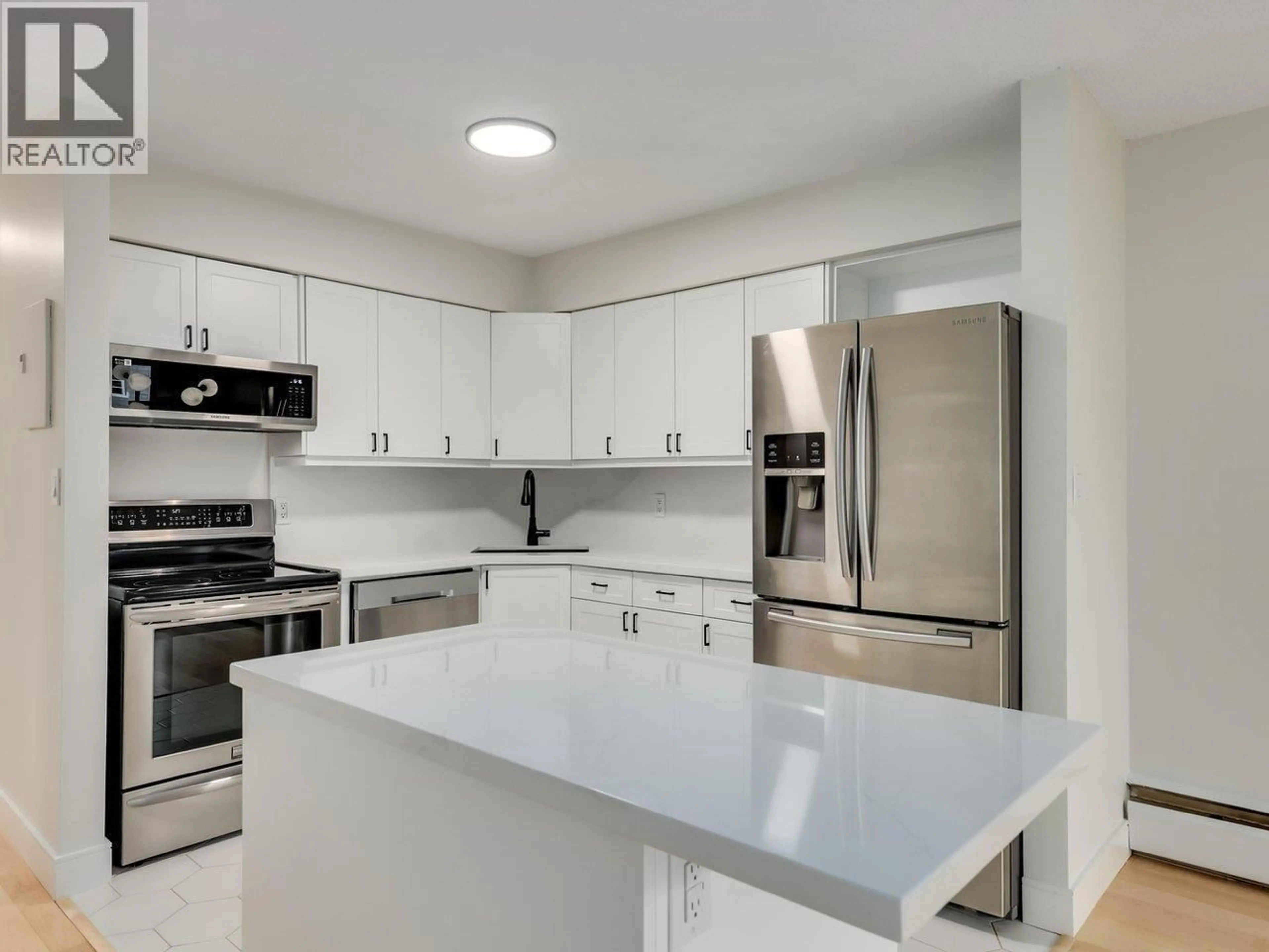 Open concept kitchen, ceramic/tile floor for 307 - 2255 YORK AVENUE, Vancouver British Columbia V6K1C5