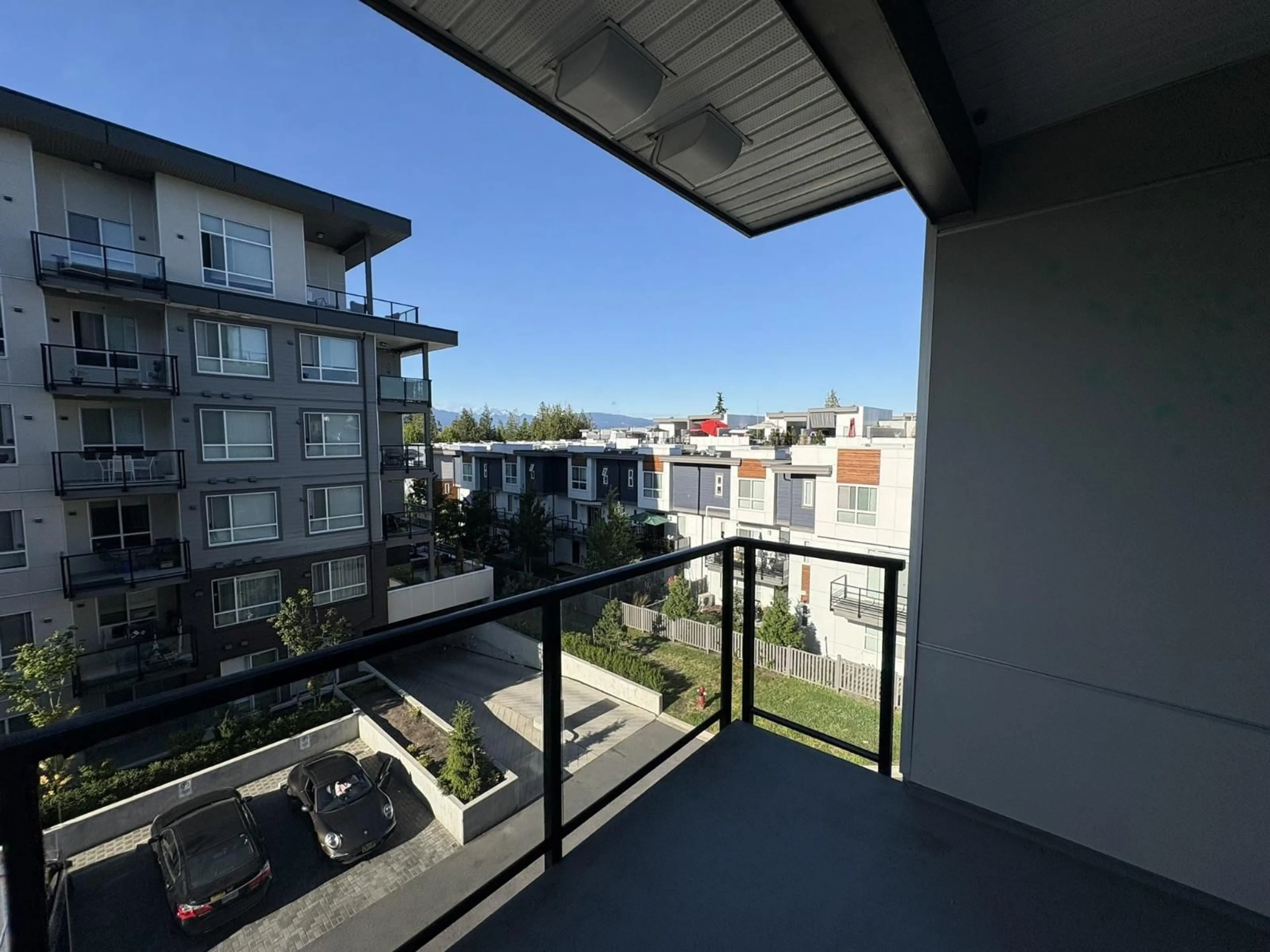 Balcony in the apartment, city buildings view from balcony for A401 - 20834 80 AVENUE, Langley British Columbia V2Y3M3