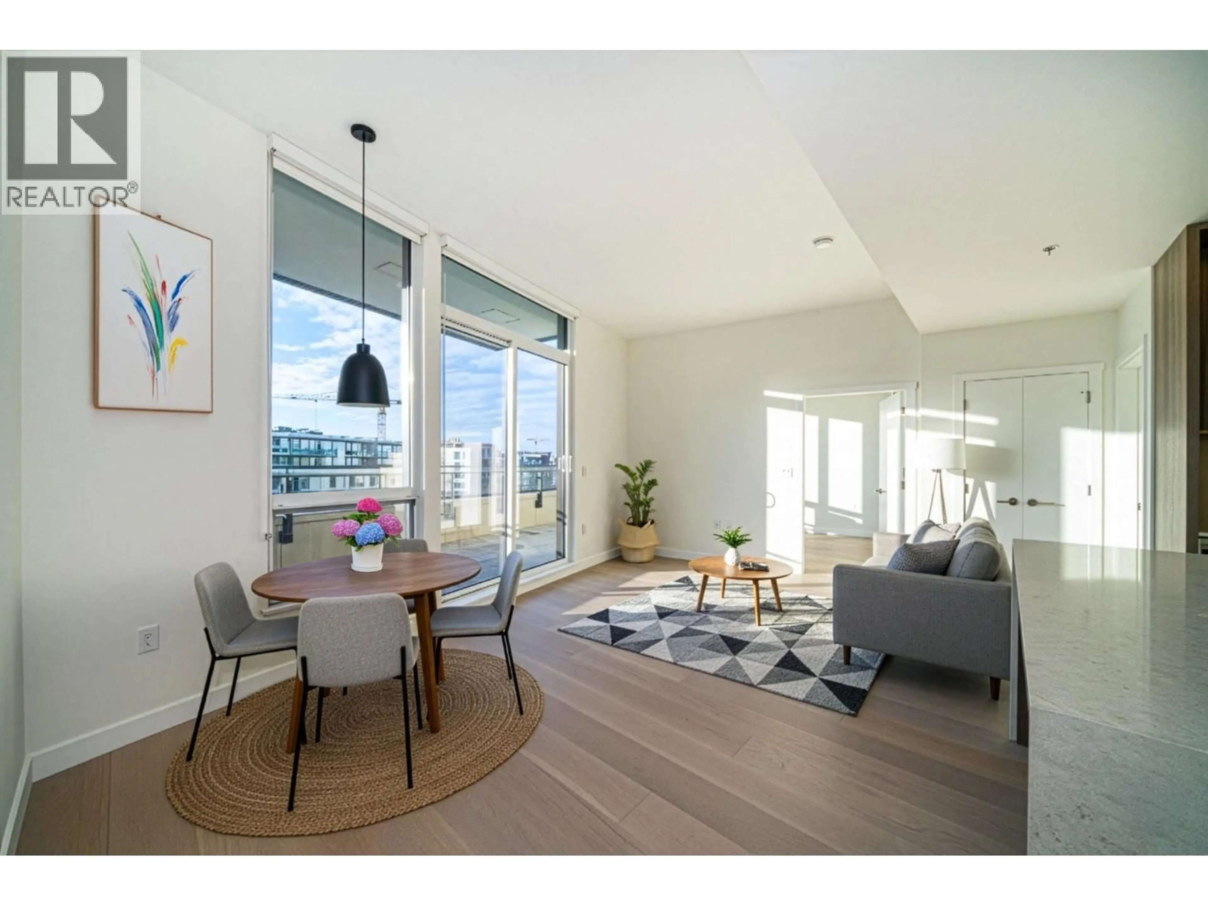Living room with furniture, wood/laminate floor for 506 - 5212 CAMBIE STREET, Vancouver British Columbia V5Z2Z7