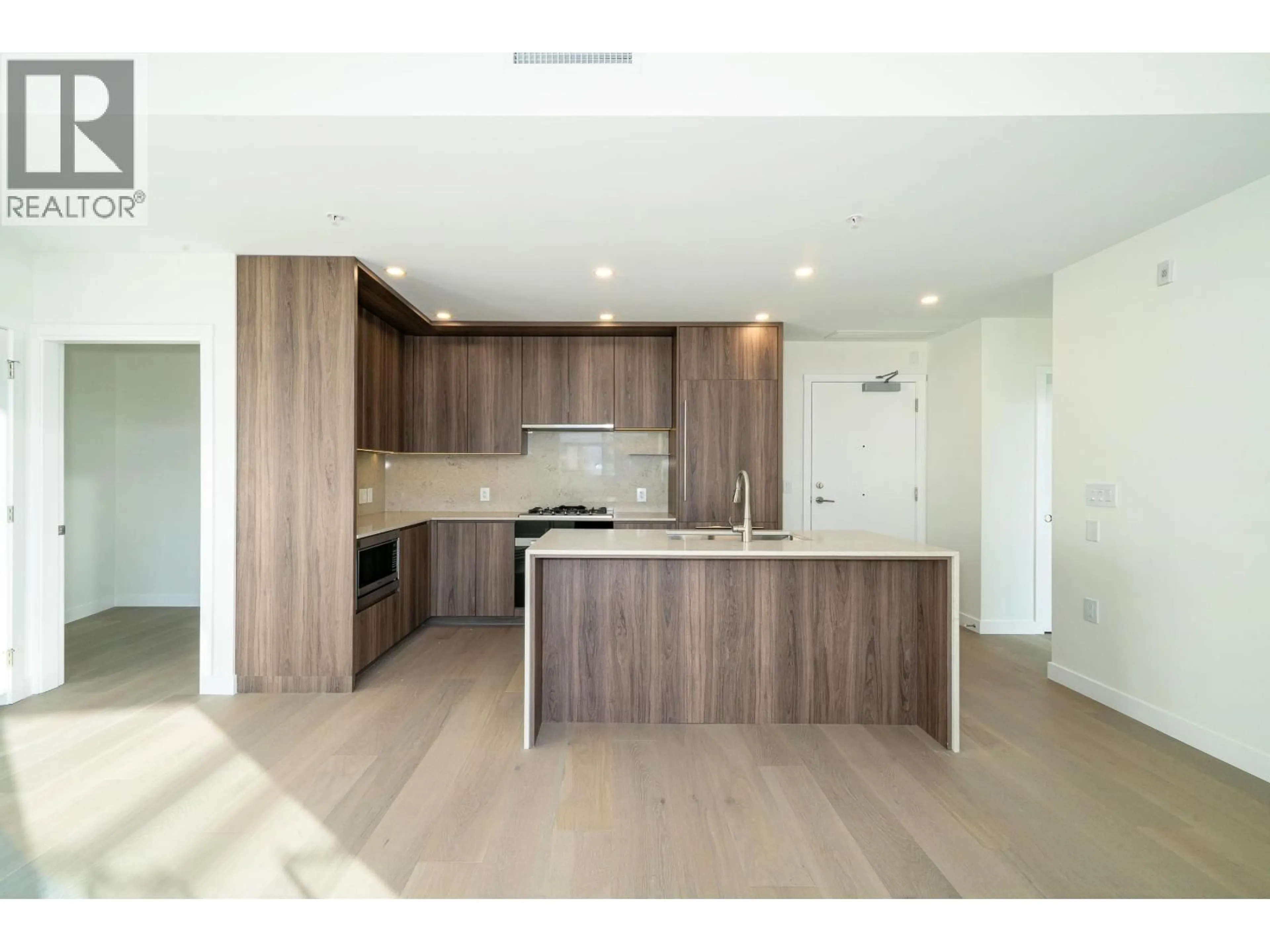 Open concept kitchen, wood/laminate floor for 506 - 5212 CAMBIE STREET, Vancouver British Columbia V5Z2Z7