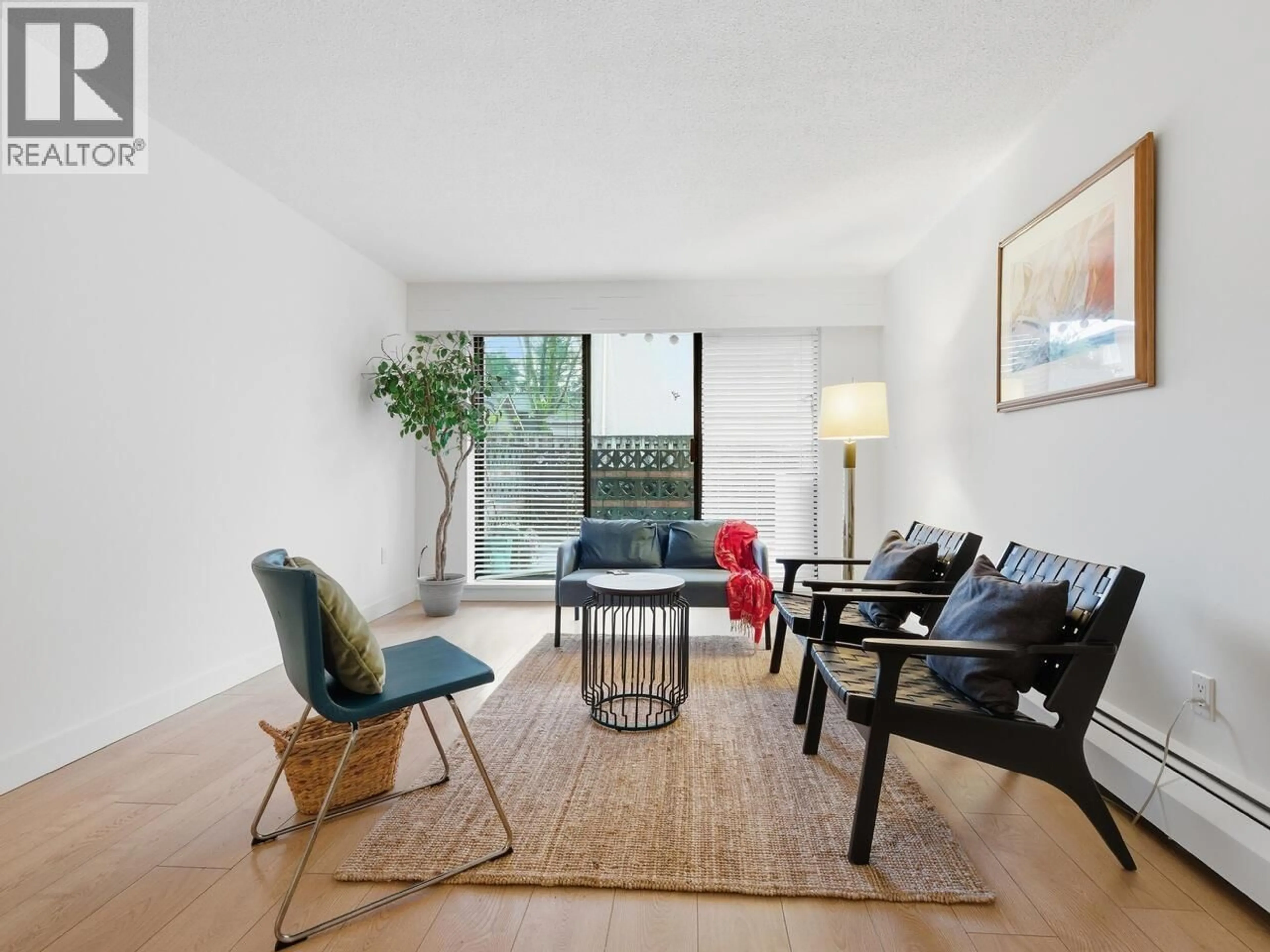 Living room with furniture, wood/laminate floor for 101 - 2910 ONTARIO STREET, Vancouver British Columbia V5T2Y6