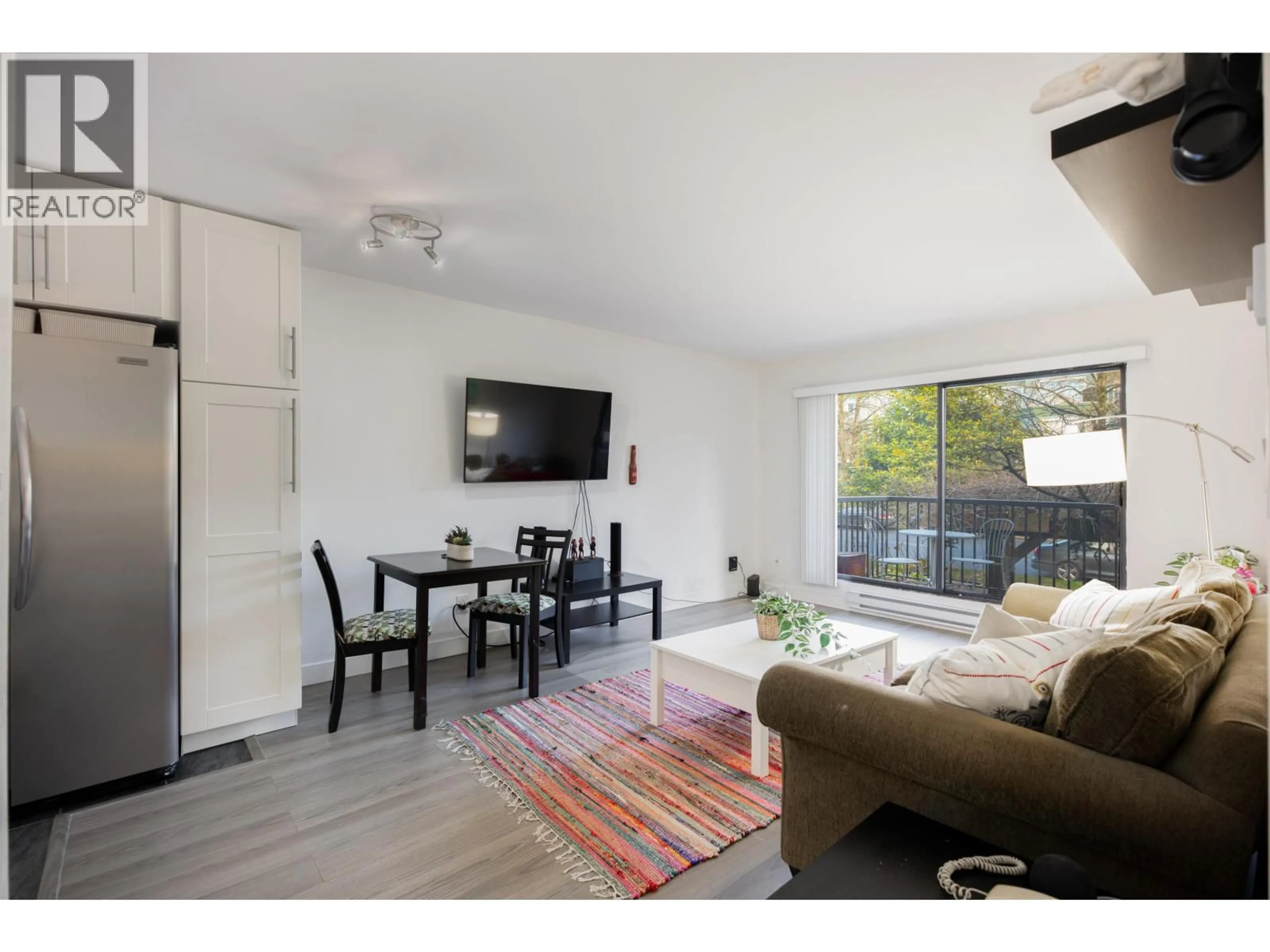 Living room with furniture, wood/laminate floor for 215 - 251 4TH STREET, North Vancouver British Columbia V7M1H8