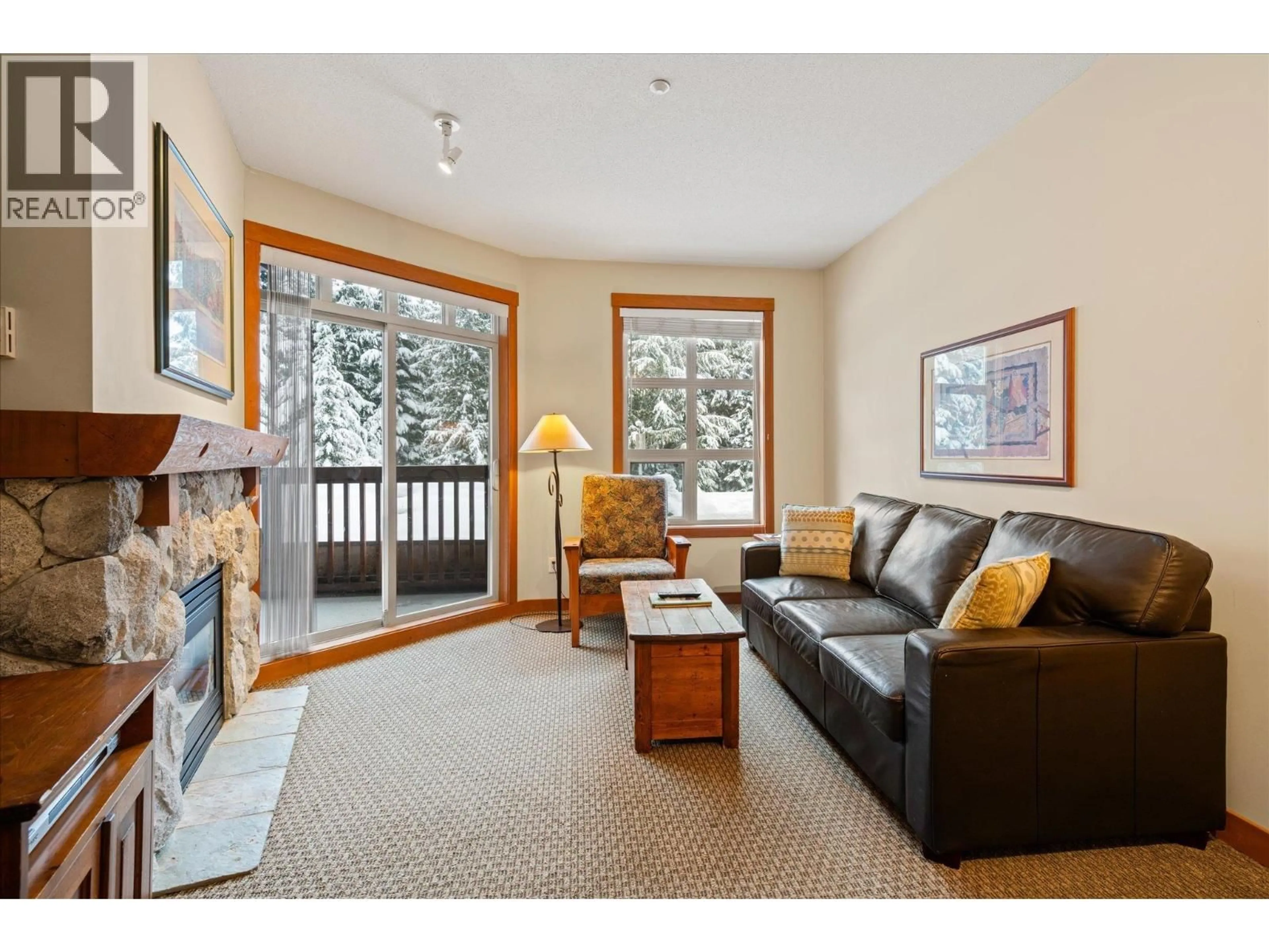 Living room with furniture, wood/laminate floor for 212 - 4660 BLACKCOMB WAY, Whistler British Columbia V8E0Y8