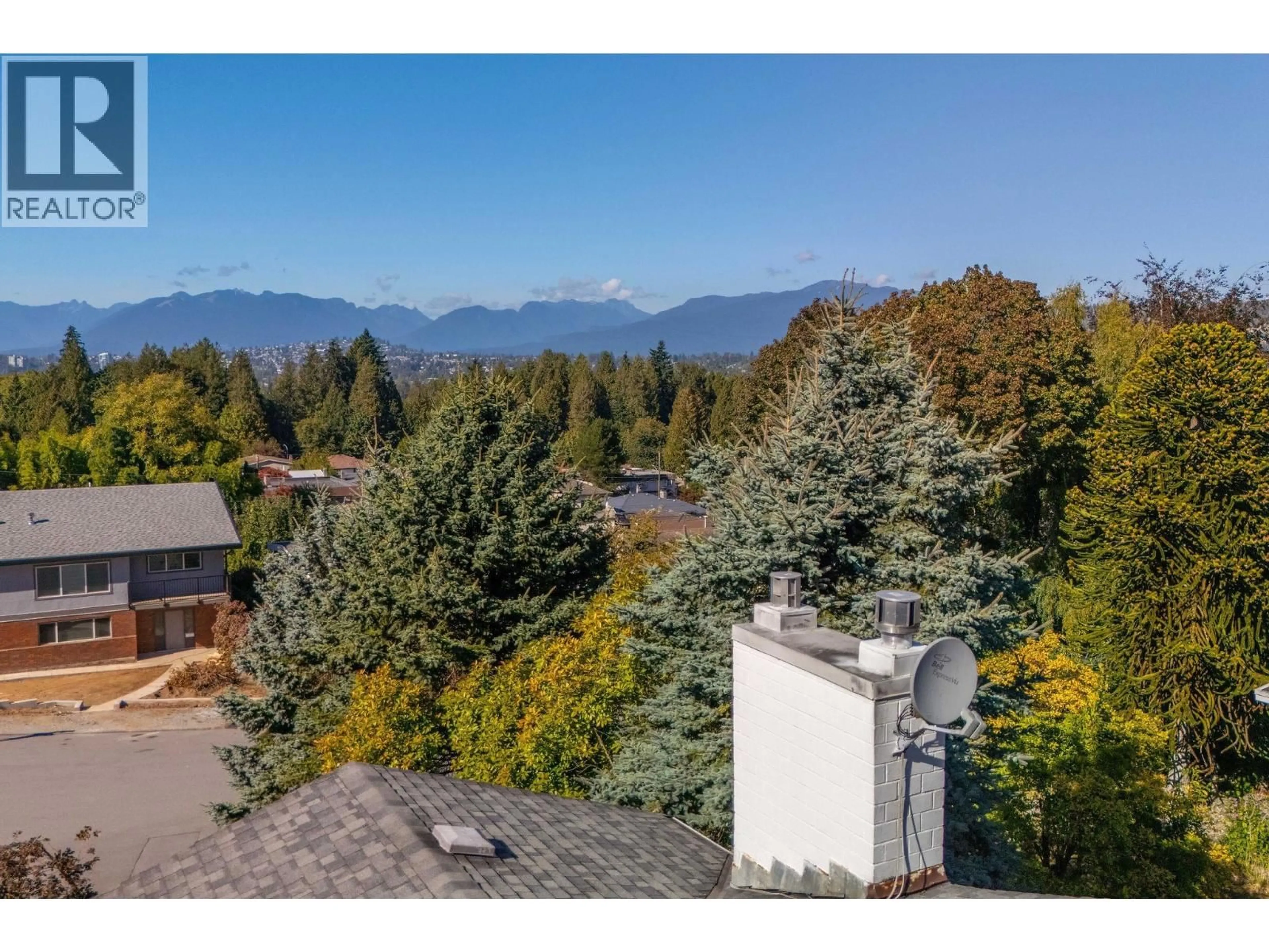 A pic from outside/outdoor area/front of a property/back of a property/a pic from drone, mountain view for 7740 ALLMAN STREET, Burnaby British Columbia V5E2B1