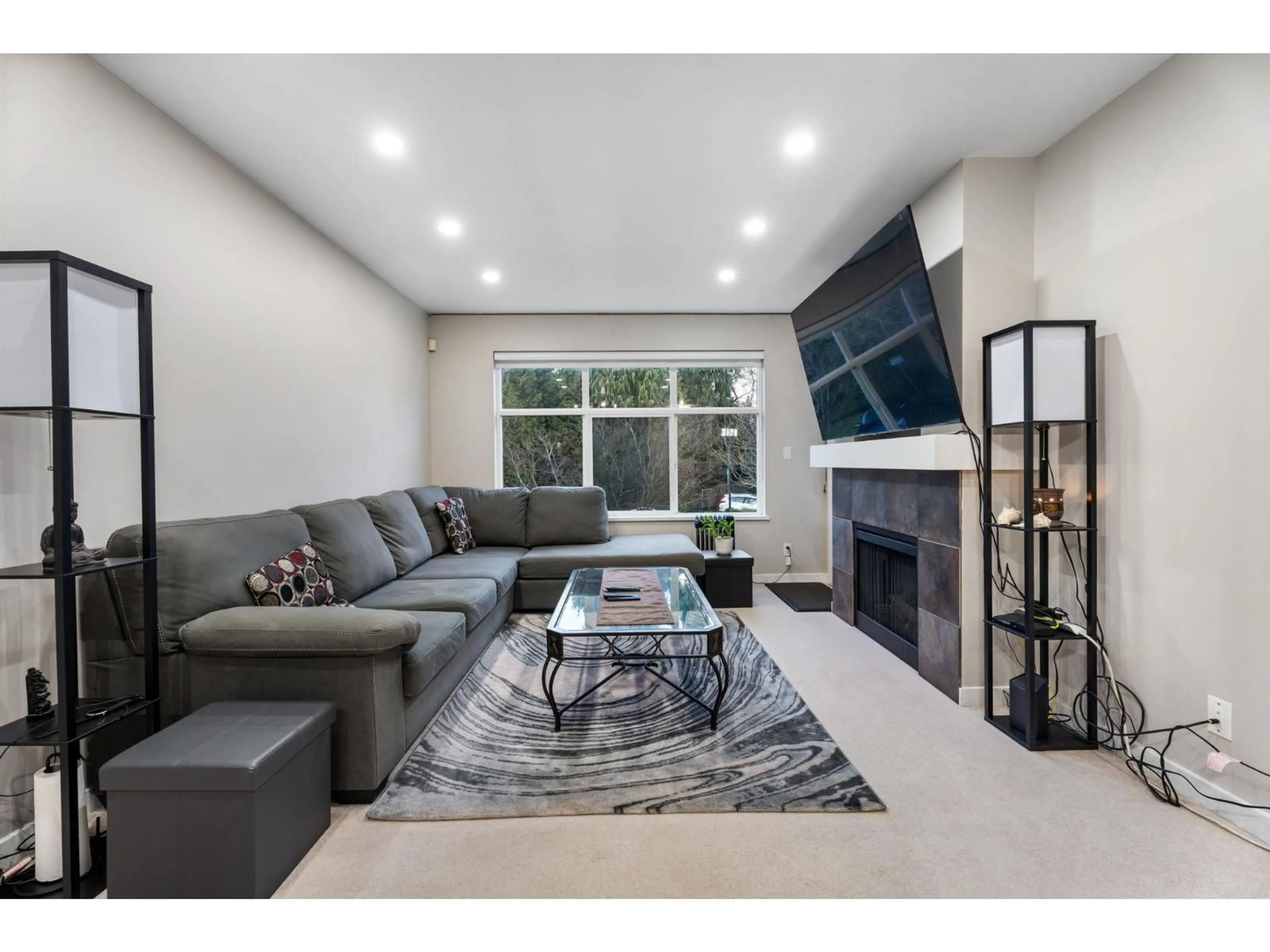 Living room with furniture, ceramic/tile floor for 203 - 14885 105 AVENUE, Surrey British Columbia V3R2V6