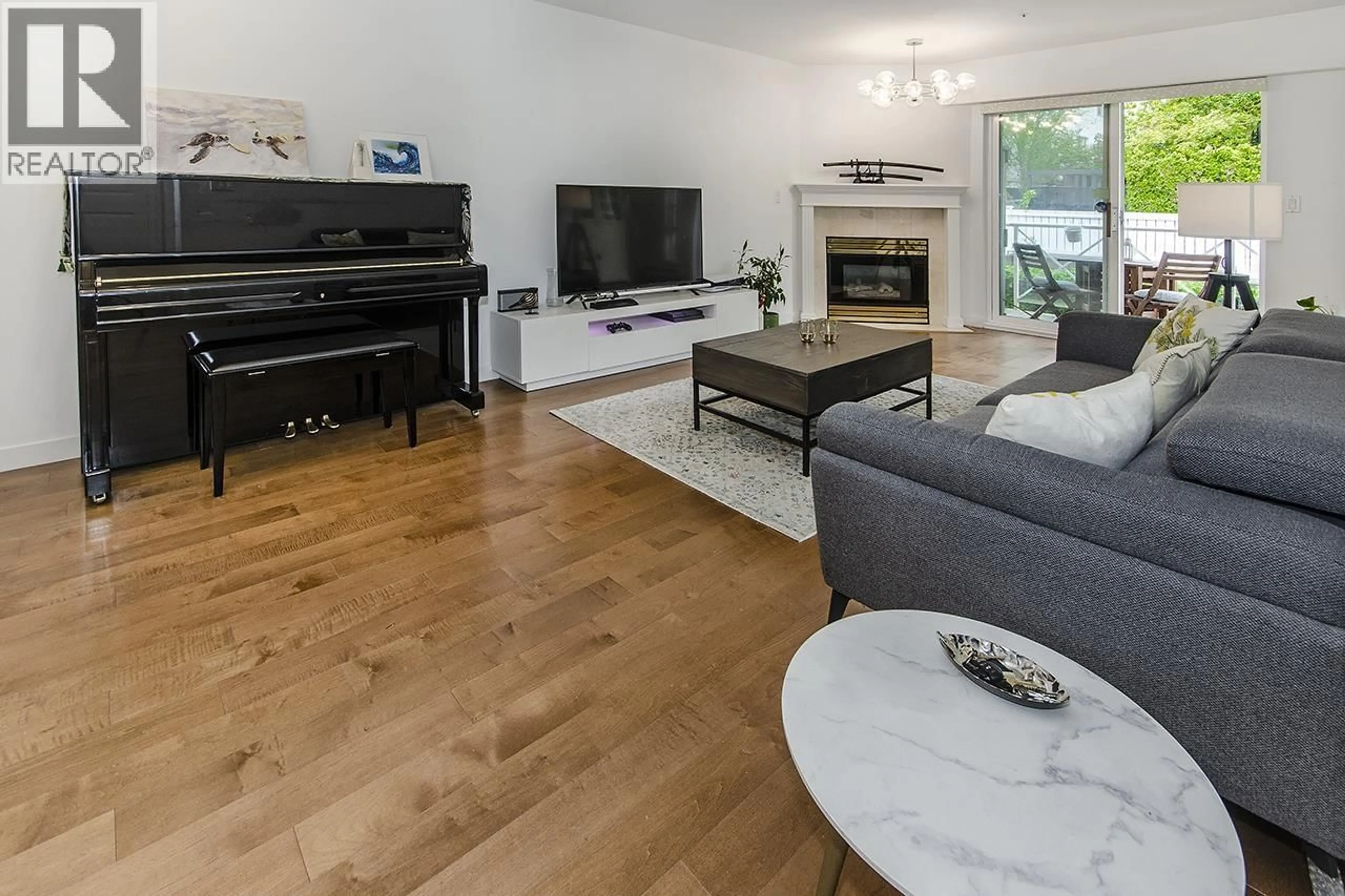 Living room with furniture, wood/laminate floor for 210 - 5788 VINE STREET, Vancouver British Columbia V6M4L8