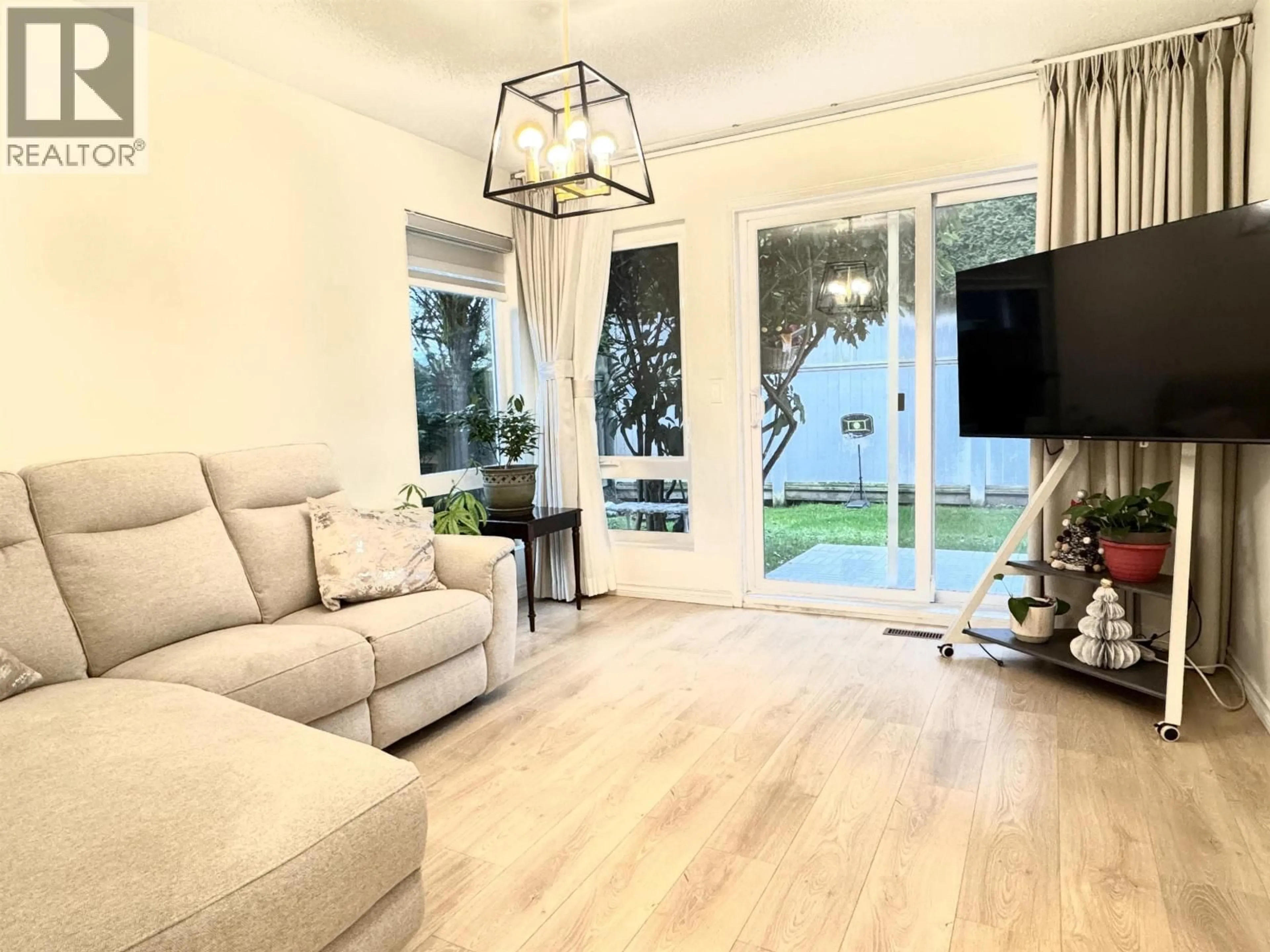 Living room with furniture, wood/laminate floor for 6 - 5111 MAPLE ROAD, Richmond British Columbia V7E5Z6