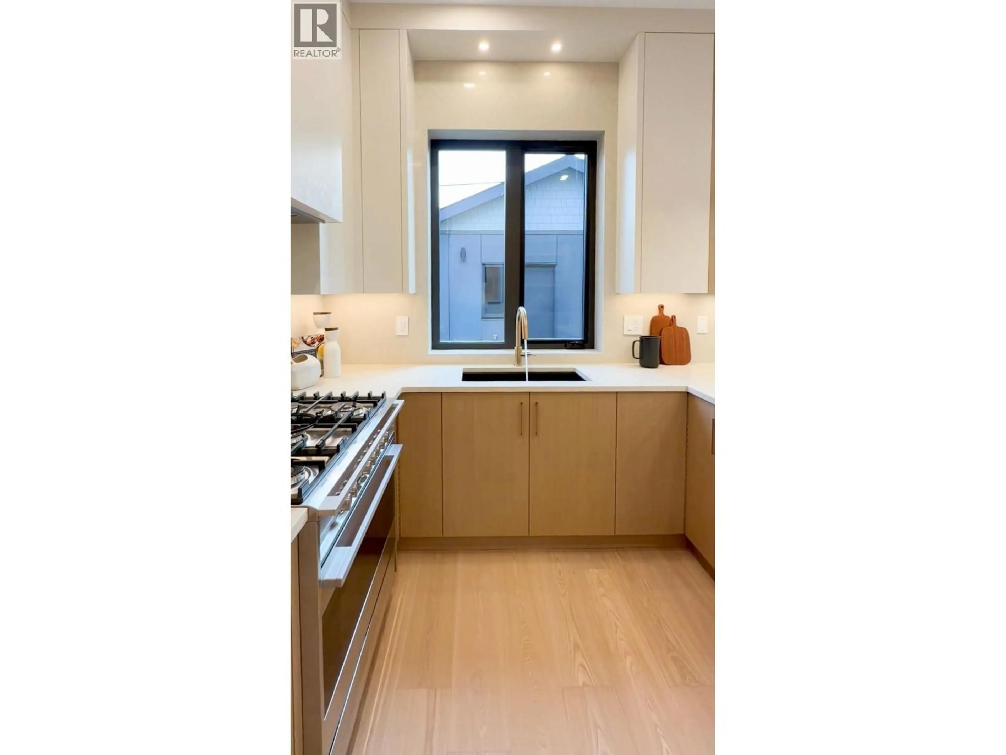 Contemporary kitchen, wood/laminate floor for 2 - 356 40TH AVENUE, Vancouver British Columbia V5W1L9