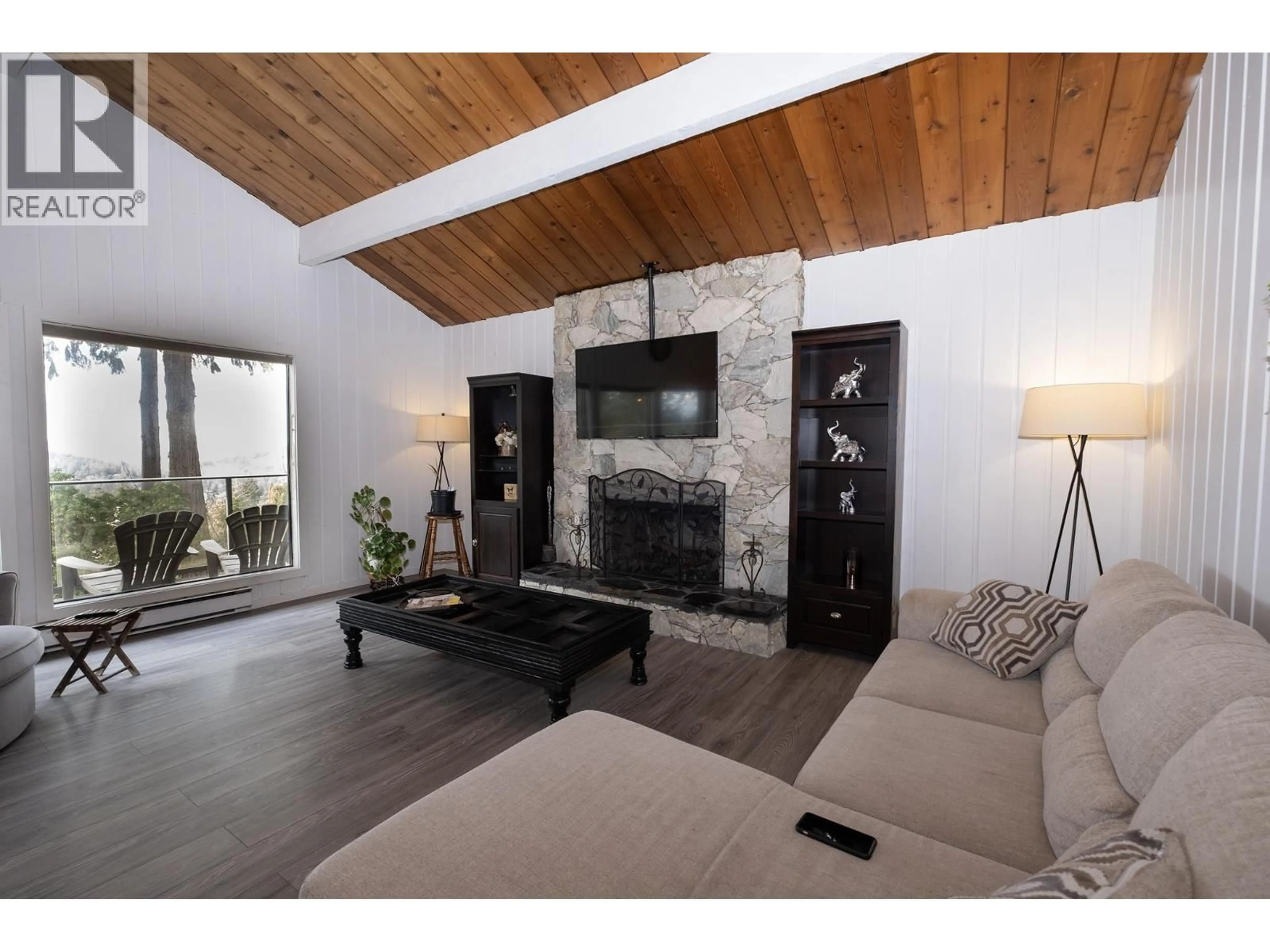 Living room with furniture, wood/laminate floor for 12870 DOGWOOD DRIVE, Pender Harbour British Columbia V0N2H1