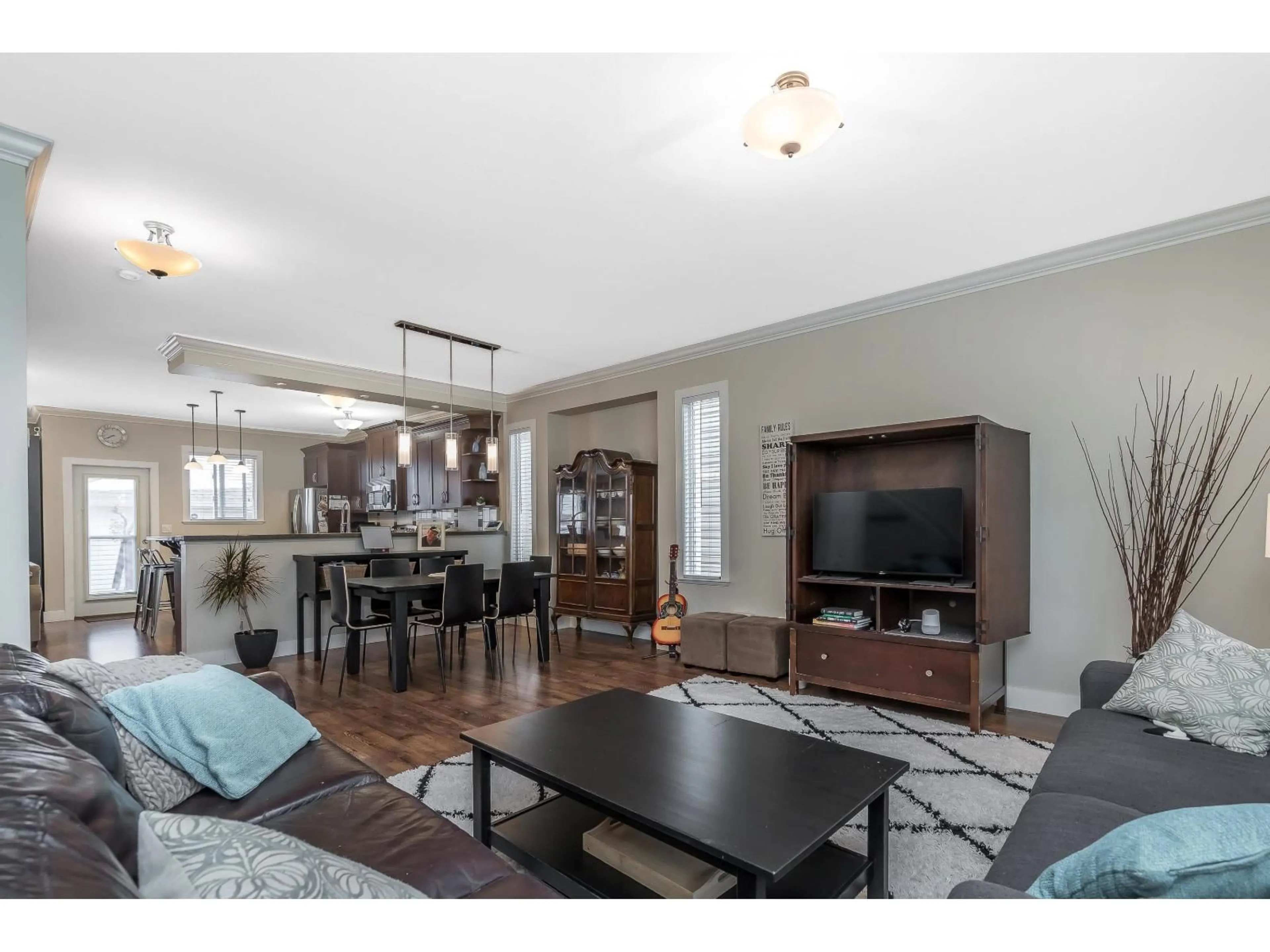 Living room with furniture, wood/laminate floor for 19232 68A AVENUE, Surrey British Columbia V4N0B6