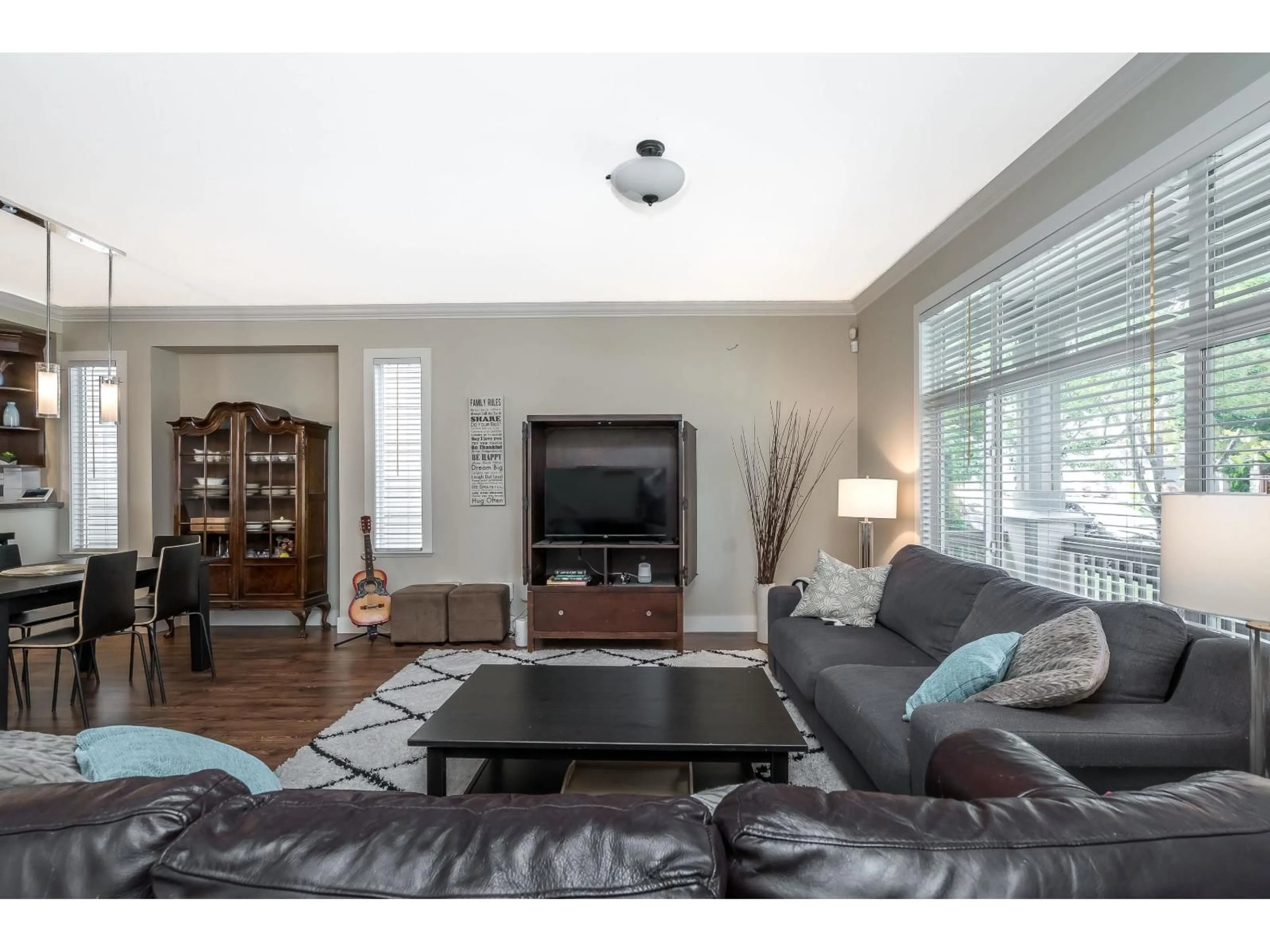 Living room with furniture, wood/laminate floor for 19232 68A AVENUE, Surrey British Columbia V4N0B6