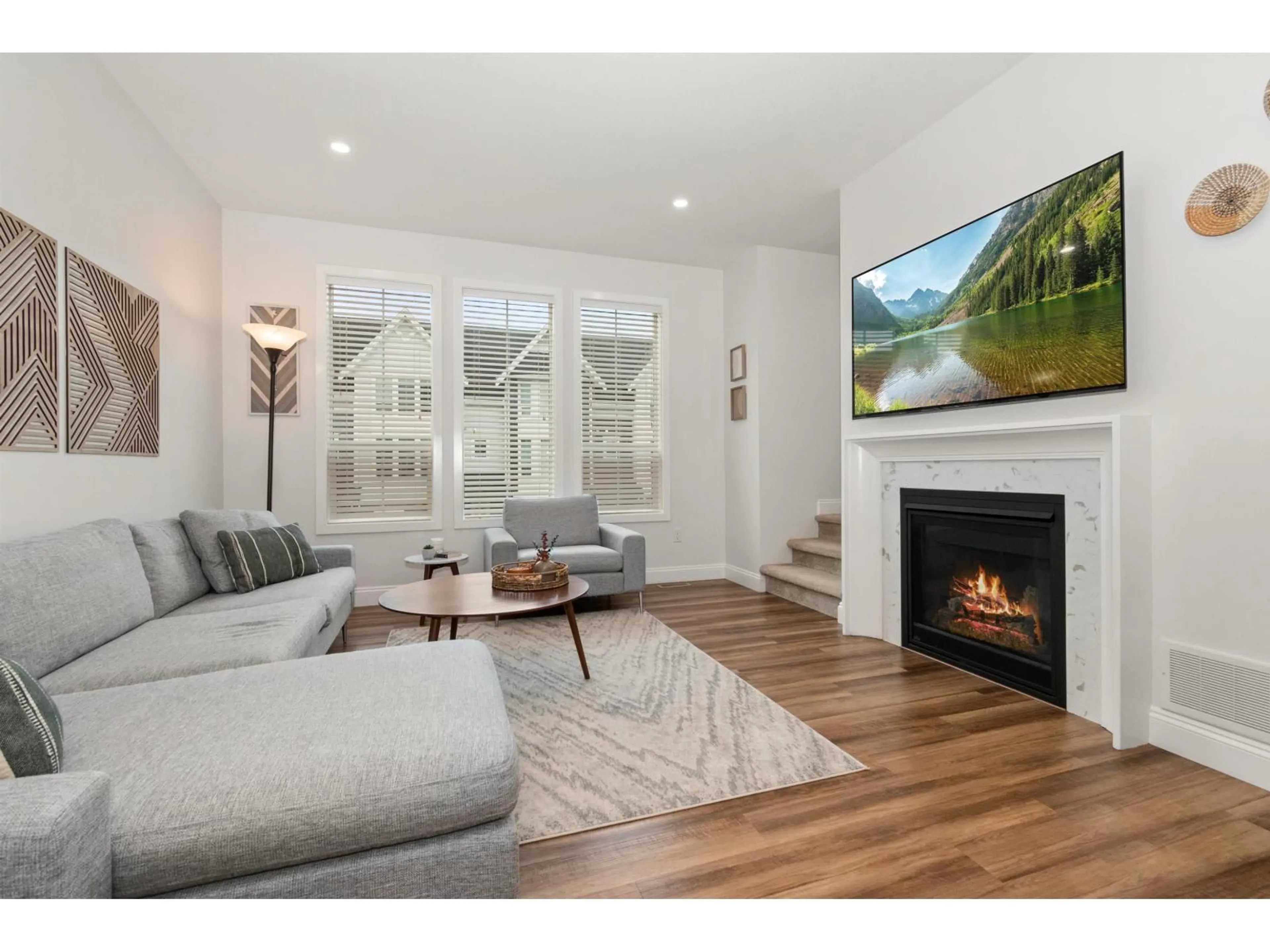 Living room with furniture, wood/laminate floor for 5524 DRIFTWOOD STREET, Chilliwack British Columbia V2R6A3