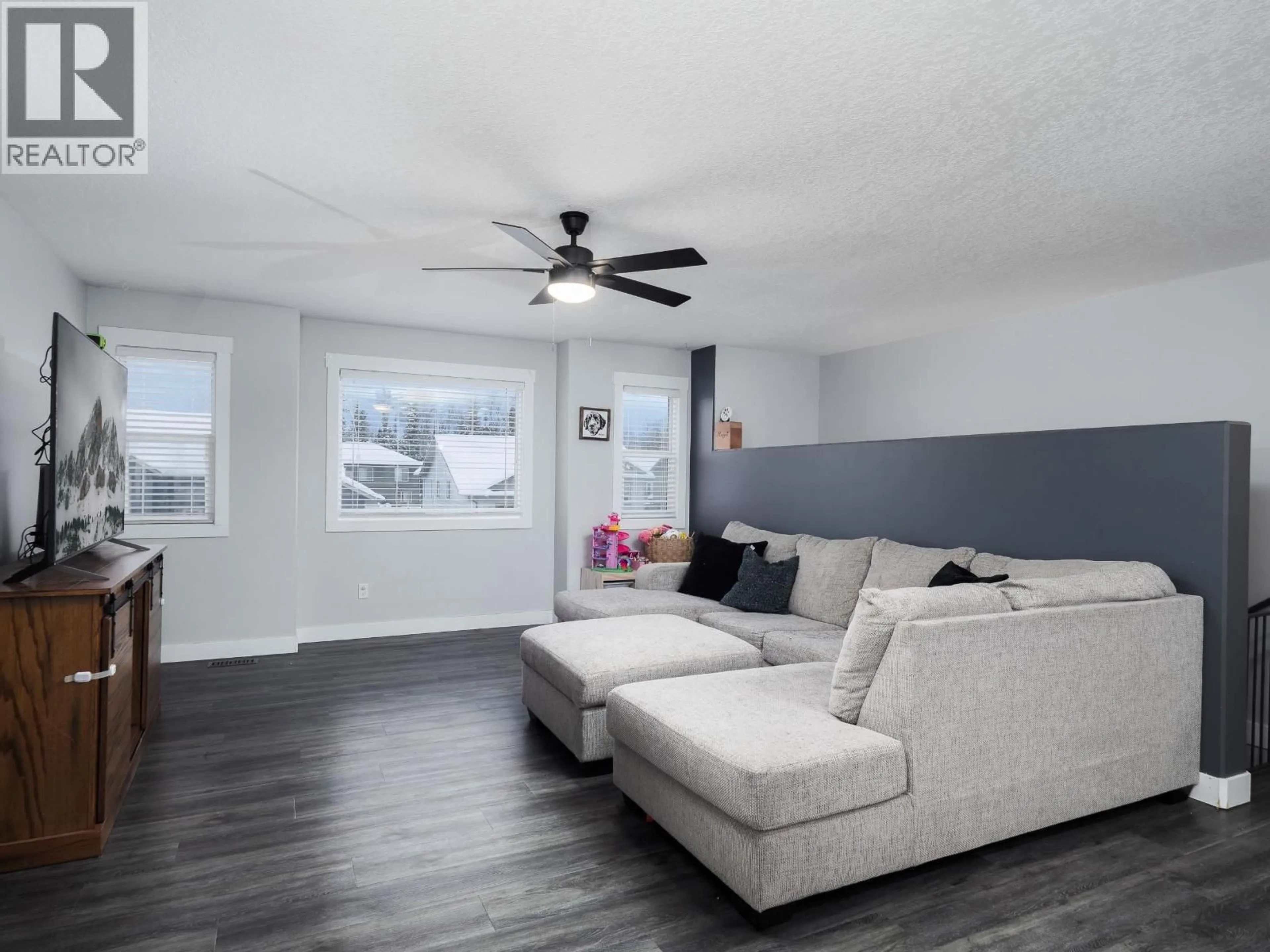 Living room with furniture, wood/laminate floor for 5228 WOODVALLEY DRIVE, Prince George British Columbia V2K5A6