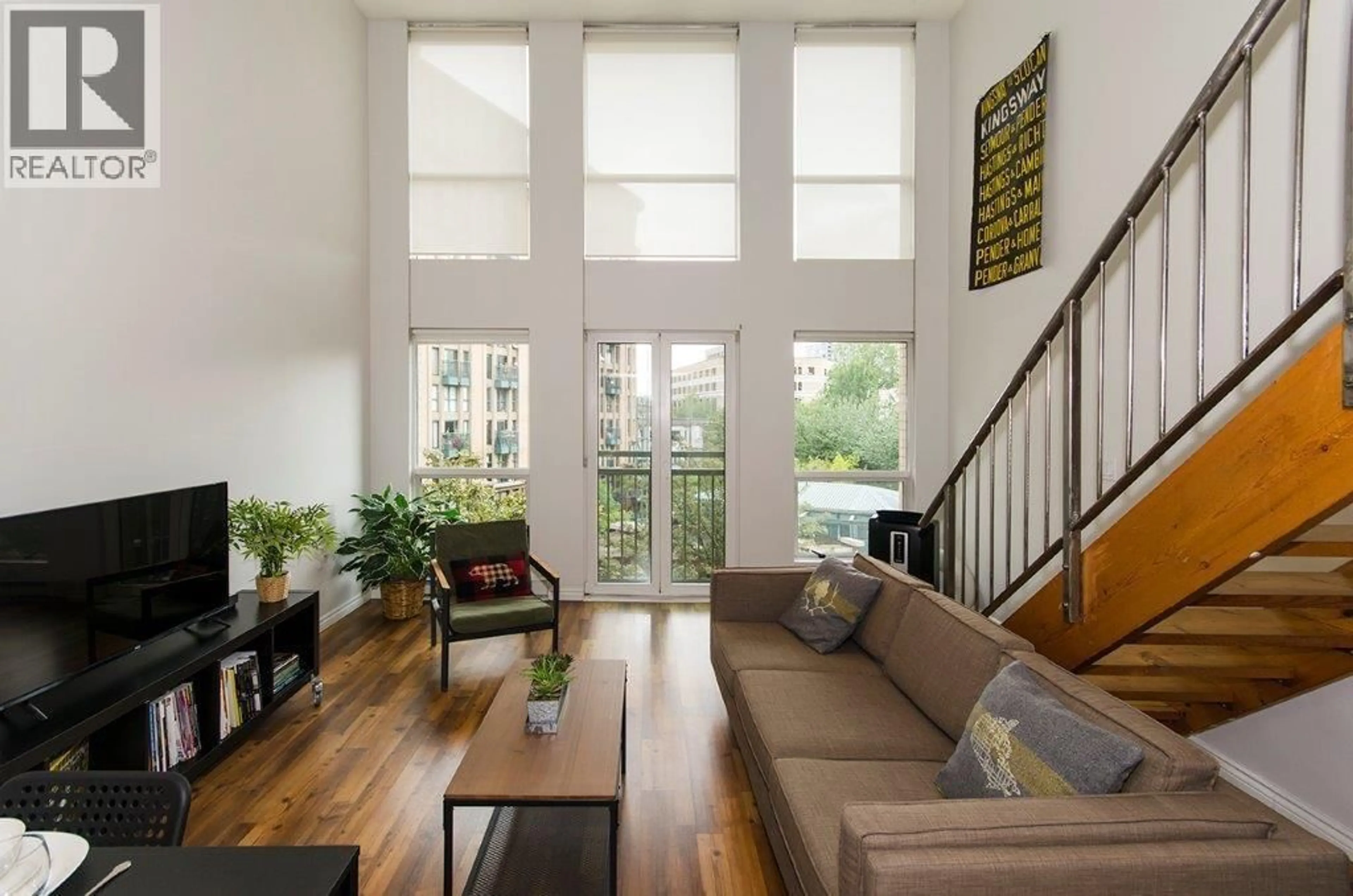 Living room with furniture, wood/laminate floor for 407 - 1 CORDOVA STREET, Vancouver British Columbia V6A4H3