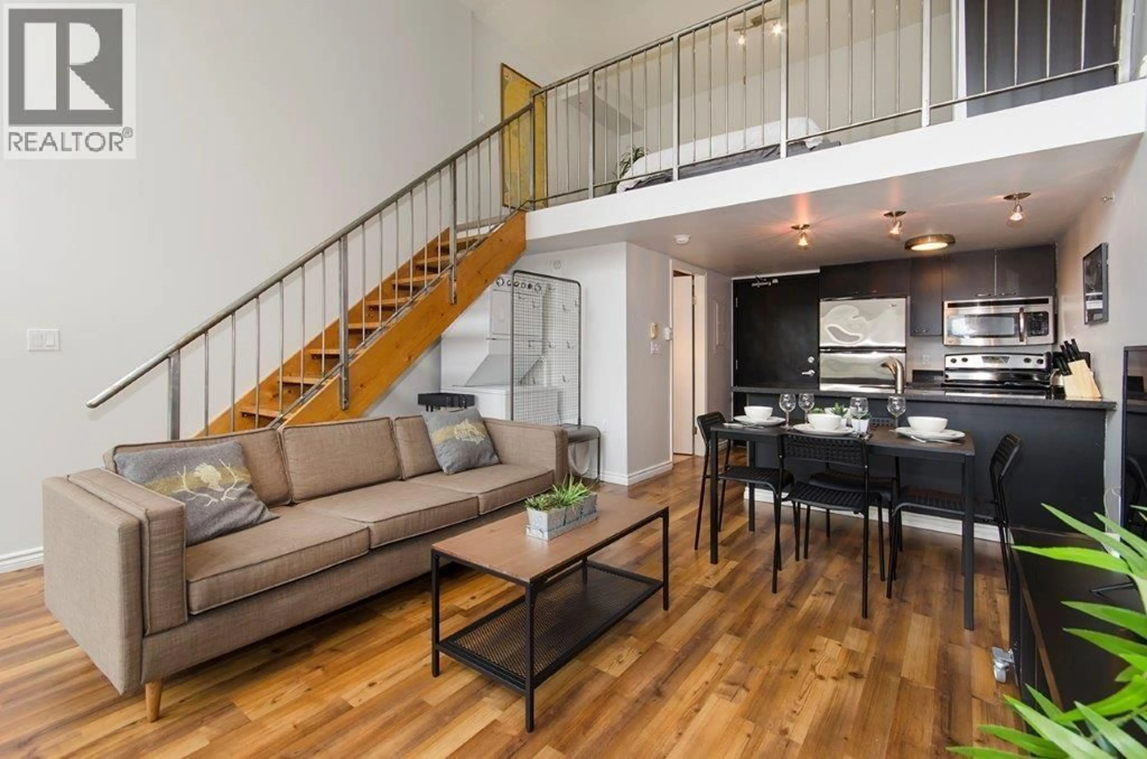 Living room with furniture, wood/laminate floor for 407 - 1 CORDOVA STREET, Vancouver British Columbia V6A4H3