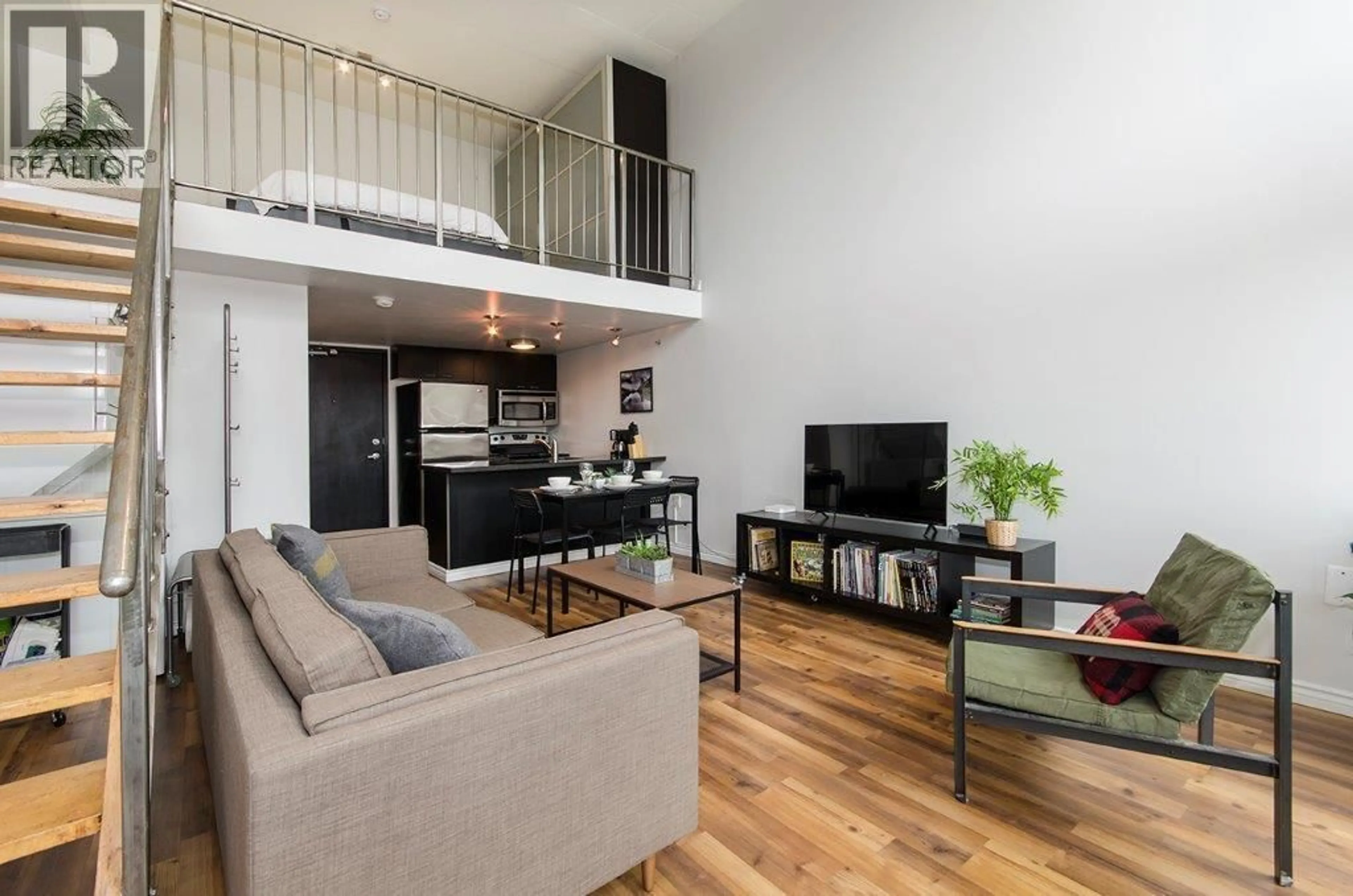 Living room with furniture, wood/laminate floor for 407 - 1 CORDOVA STREET, Vancouver British Columbia V6A4H3