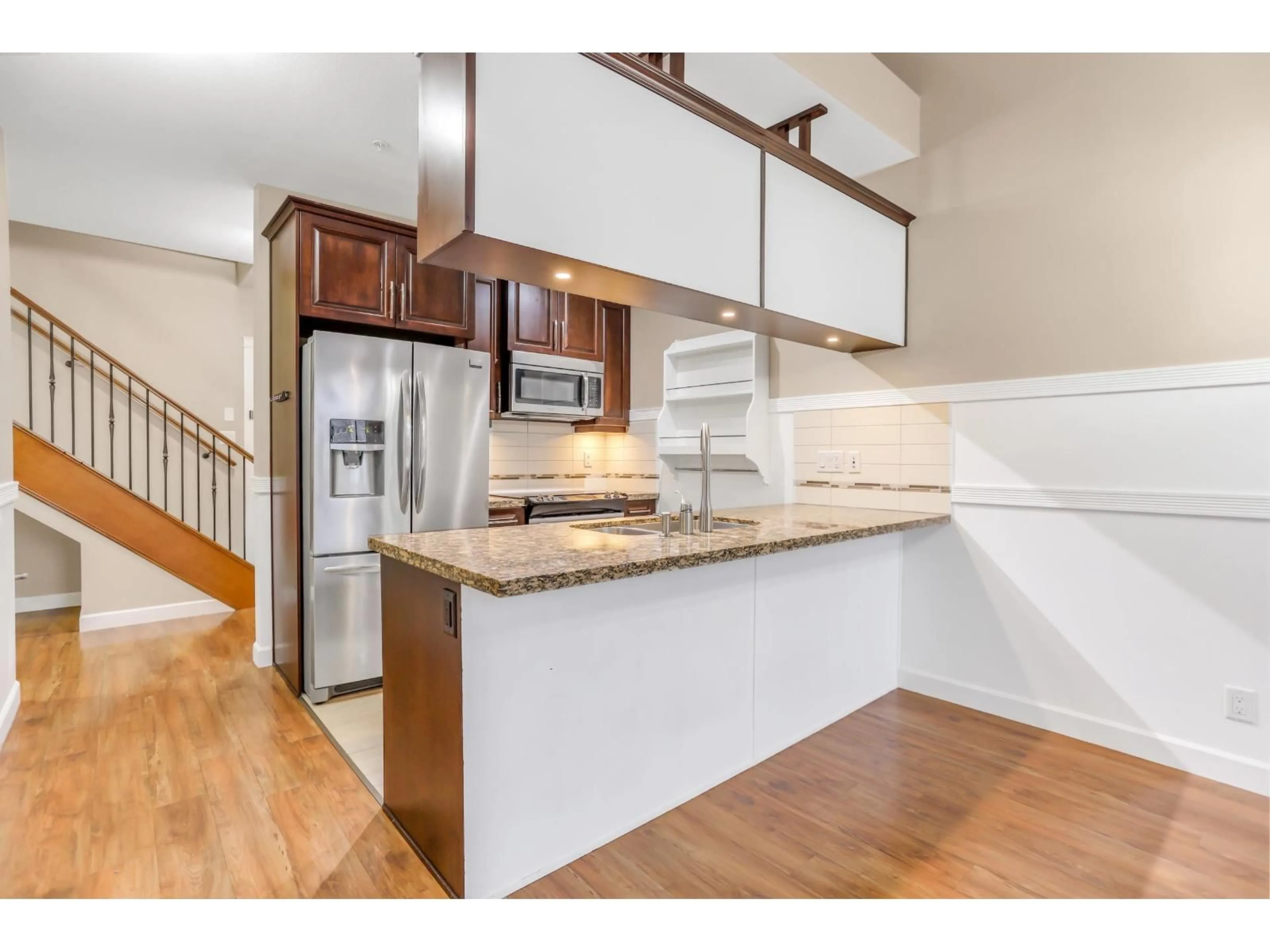 Open concept kitchen, wood/laminate floor for 561 - 8258 207A STREET, Langley British Columbia V2Y0N4