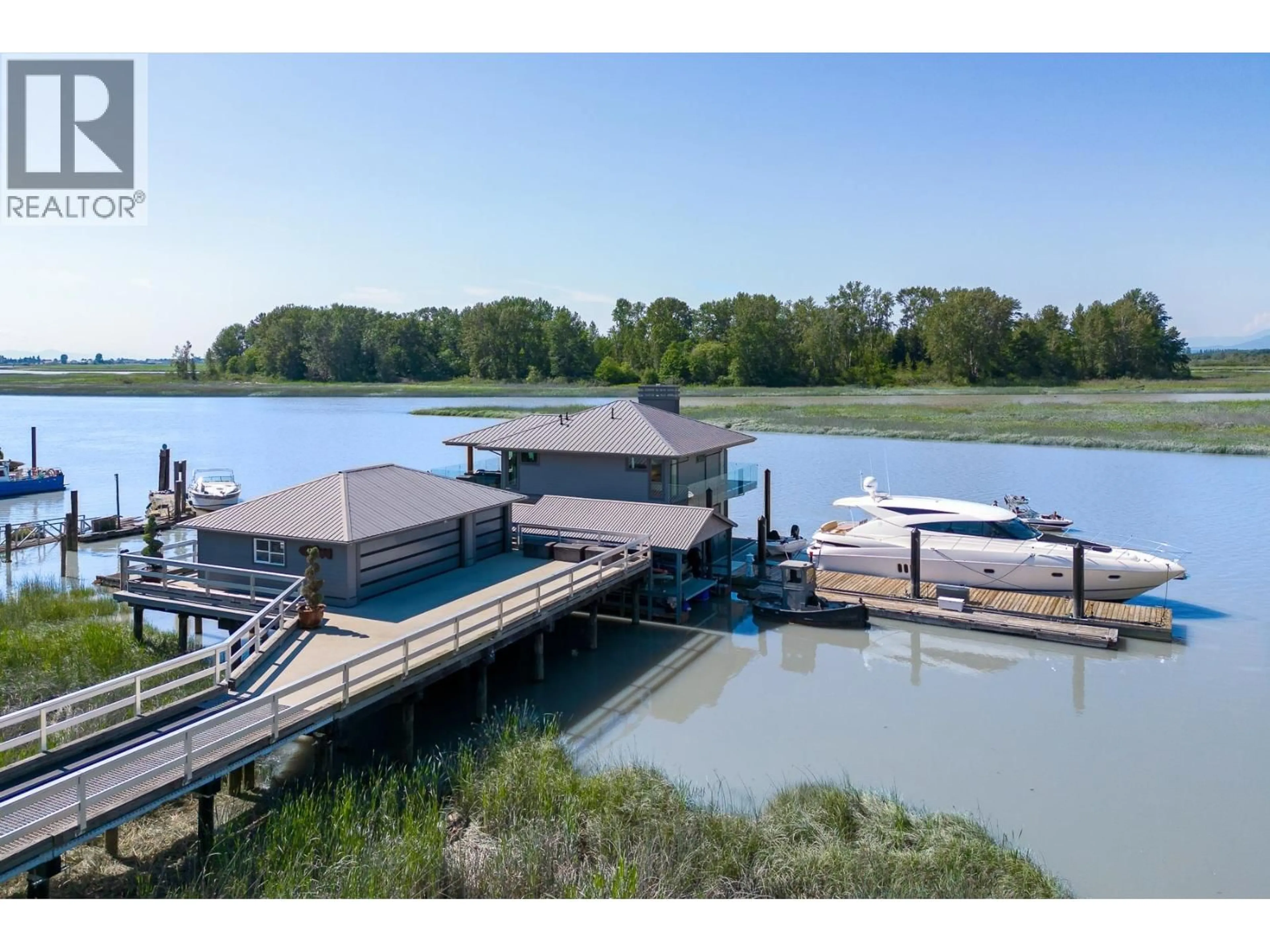 A pic from outside/outdoor area/front of a property/back of a property/a pic from drone, water/lake/river/ocean view for 4379 RIVER ROAD, Delta British Columbia V4K1R9