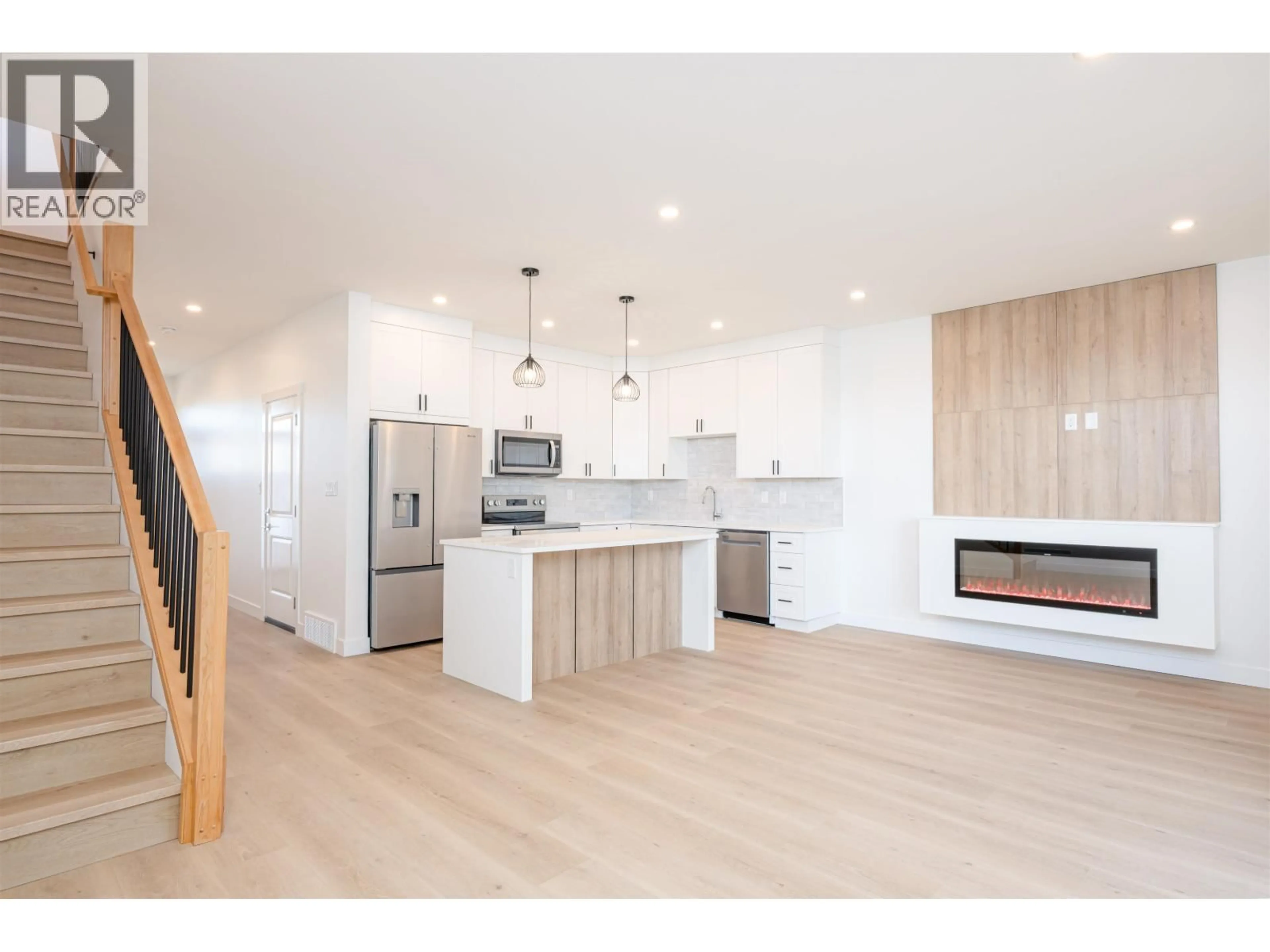 Open concept kitchen, wood/laminate floor for 101 - 7785 SOUTHRIDGE AVENUE, Prince George British Columbia V2N6S4