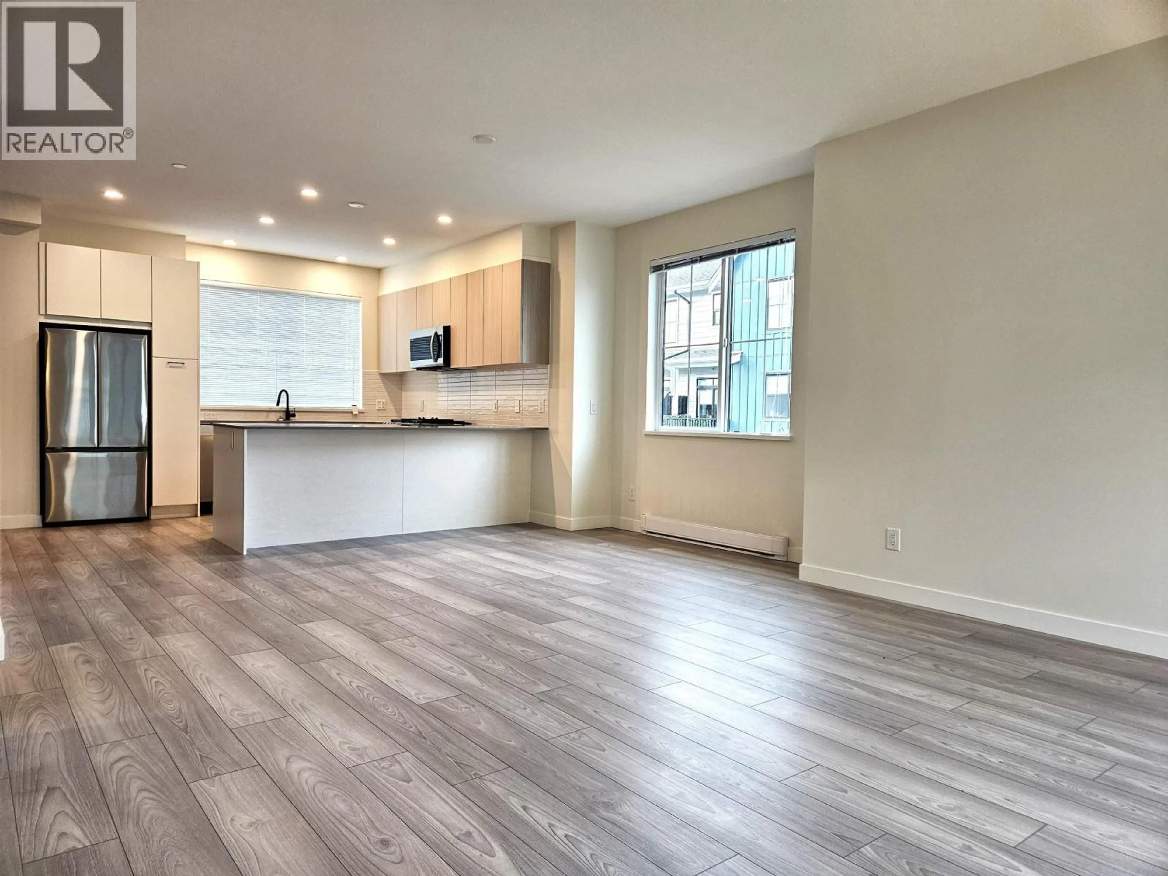 Open concept kitchen, wood/laminate floor for 139 - 488 FURNESS STREET, New Westminster British Columbia V3M0M1