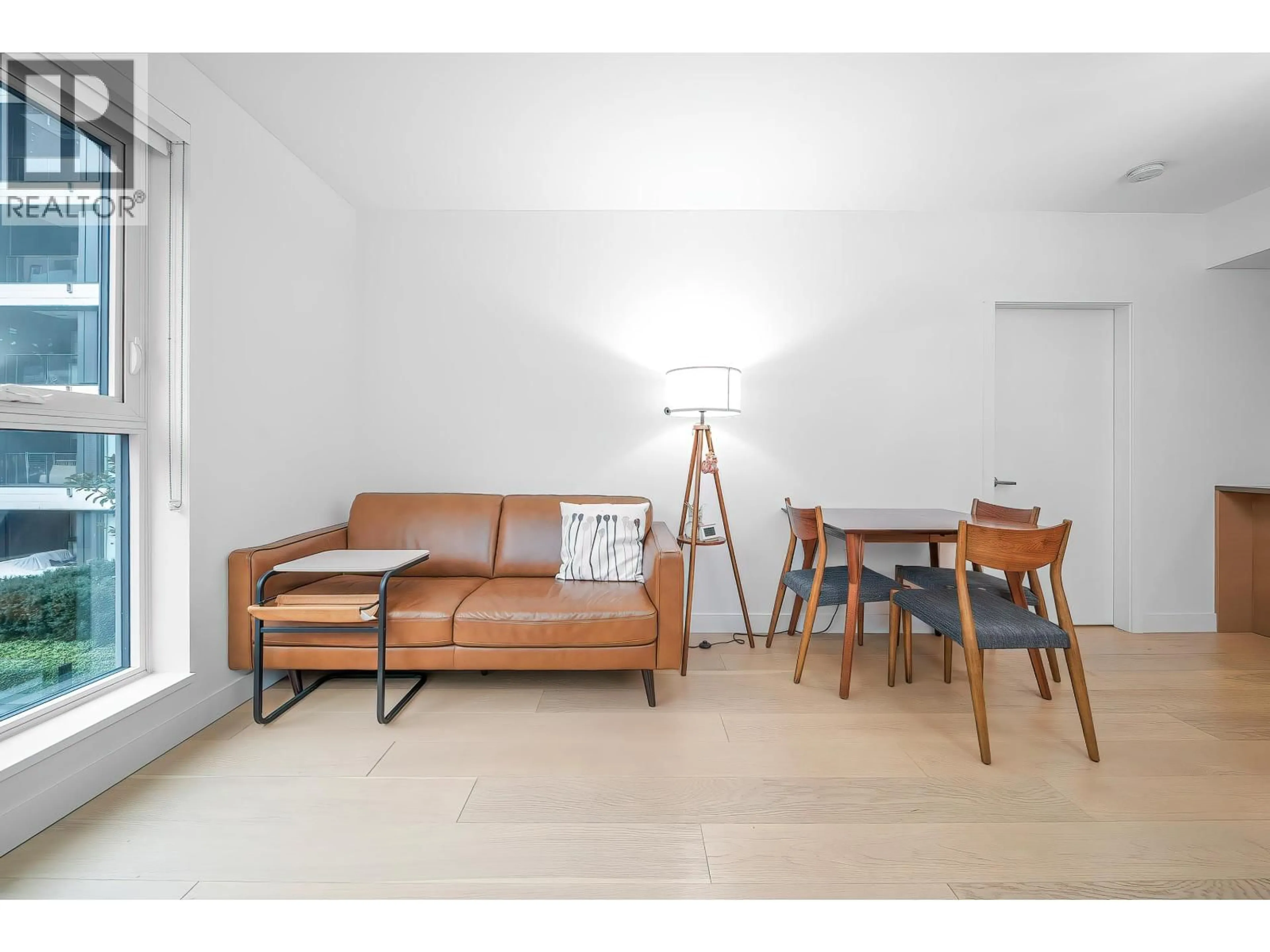 Living room with furniture, wood/laminate floor for 311 - 7228 ADERA STREET, Vancouver British Columbia V6P0H8