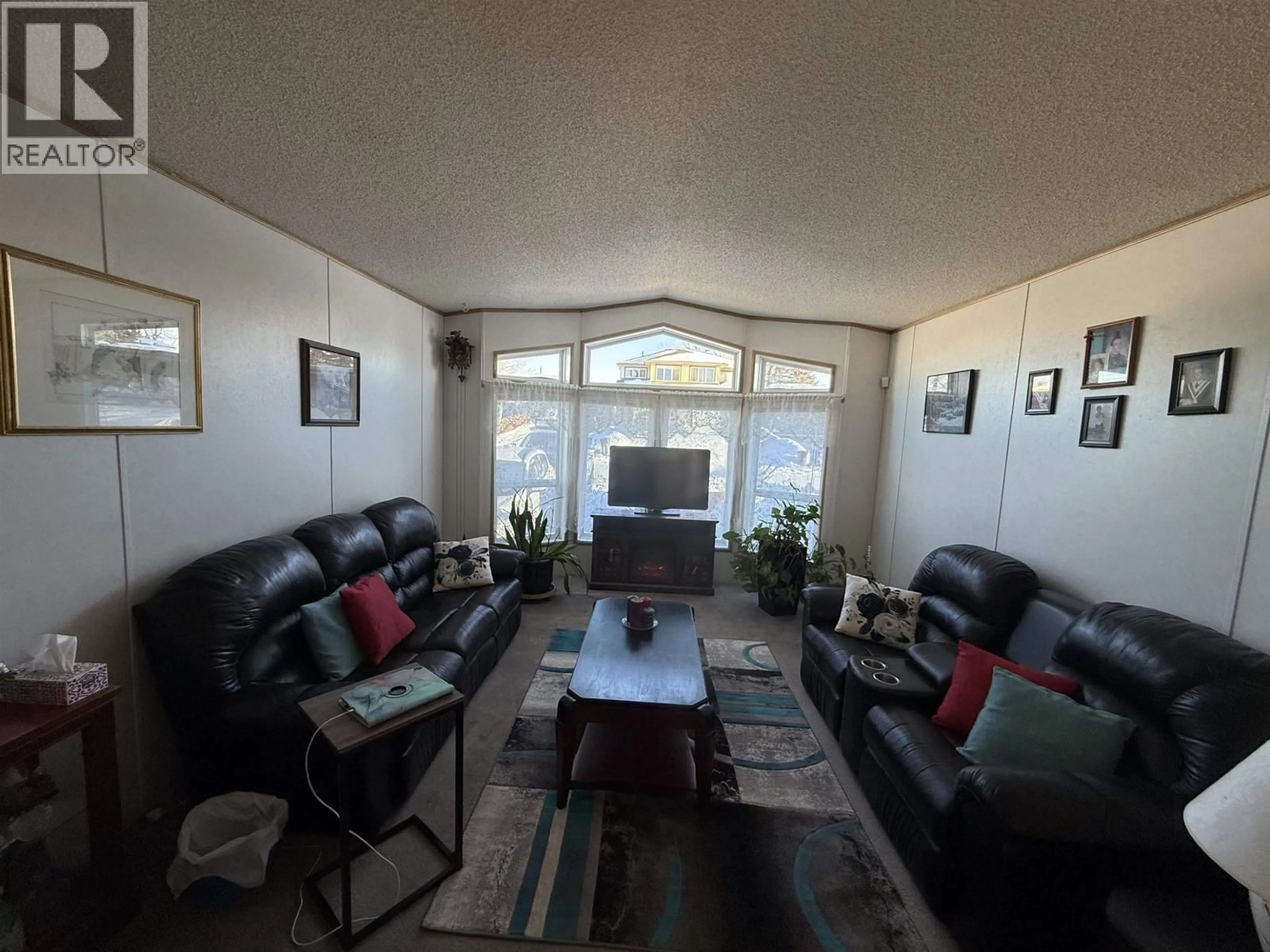 Living room with furniture, floor is not visible for 9020 75 STREET, Fort St. John British Columbia V1J2Z2