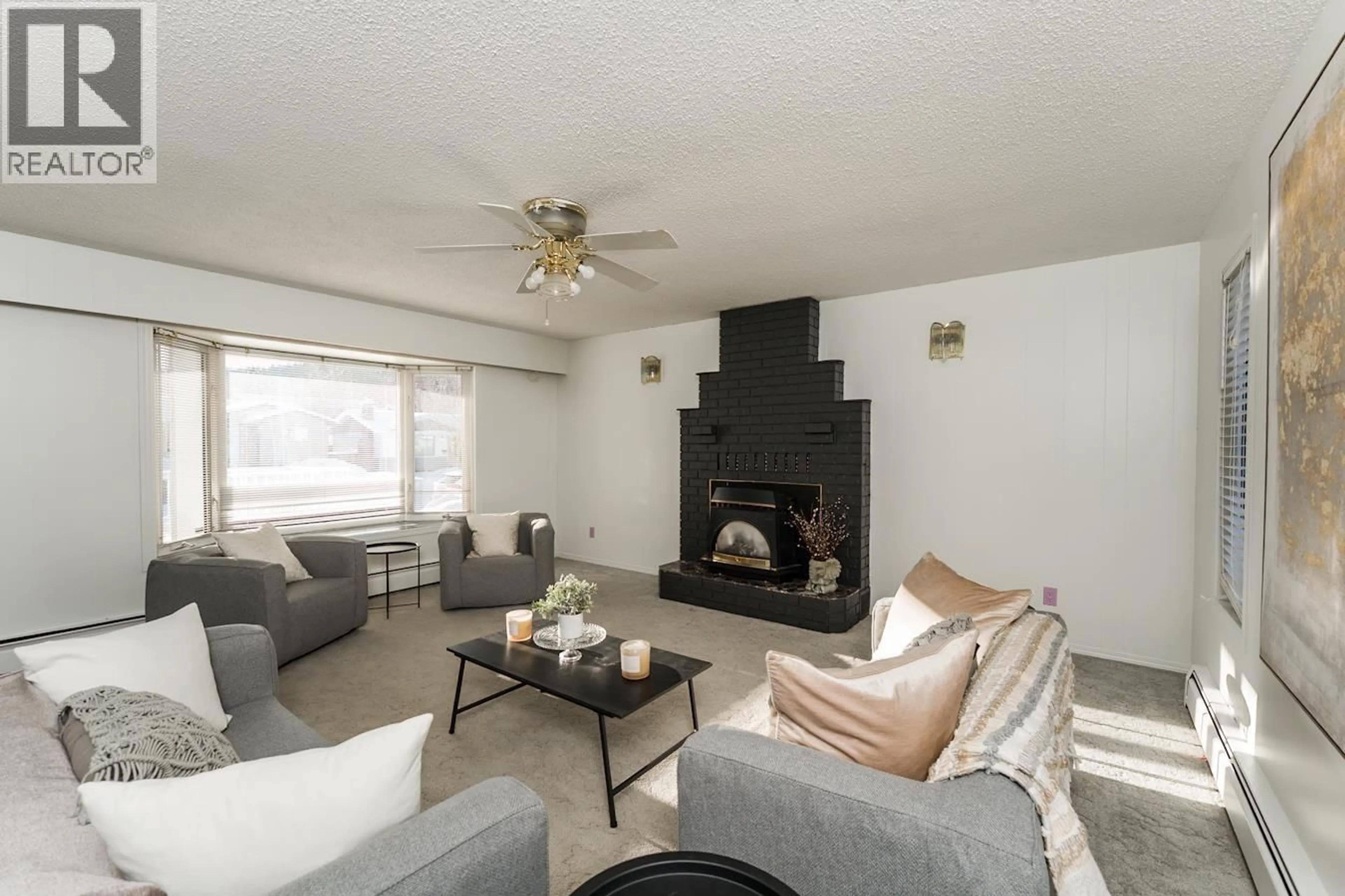 Living room with furniture, wood/laminate floor for 4574 VALLEY CRESCENT, Prince George British Columbia V2M5M1