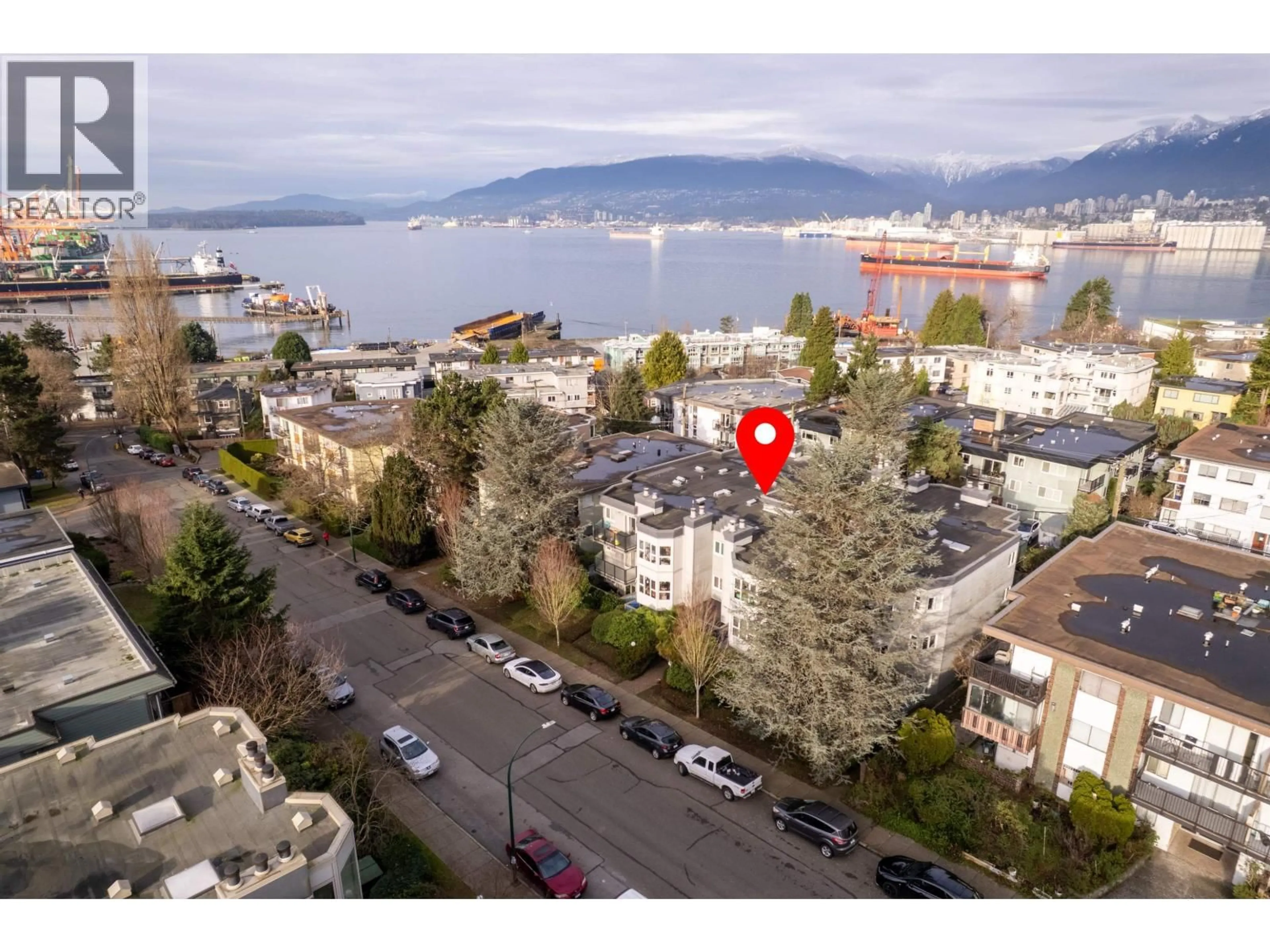 A pic from outside/outdoor area/front of a property/back of a property/a pic from drone, unknown for 208 - 2255 ETON STREET, Vancouver British Columbia V5L1C9