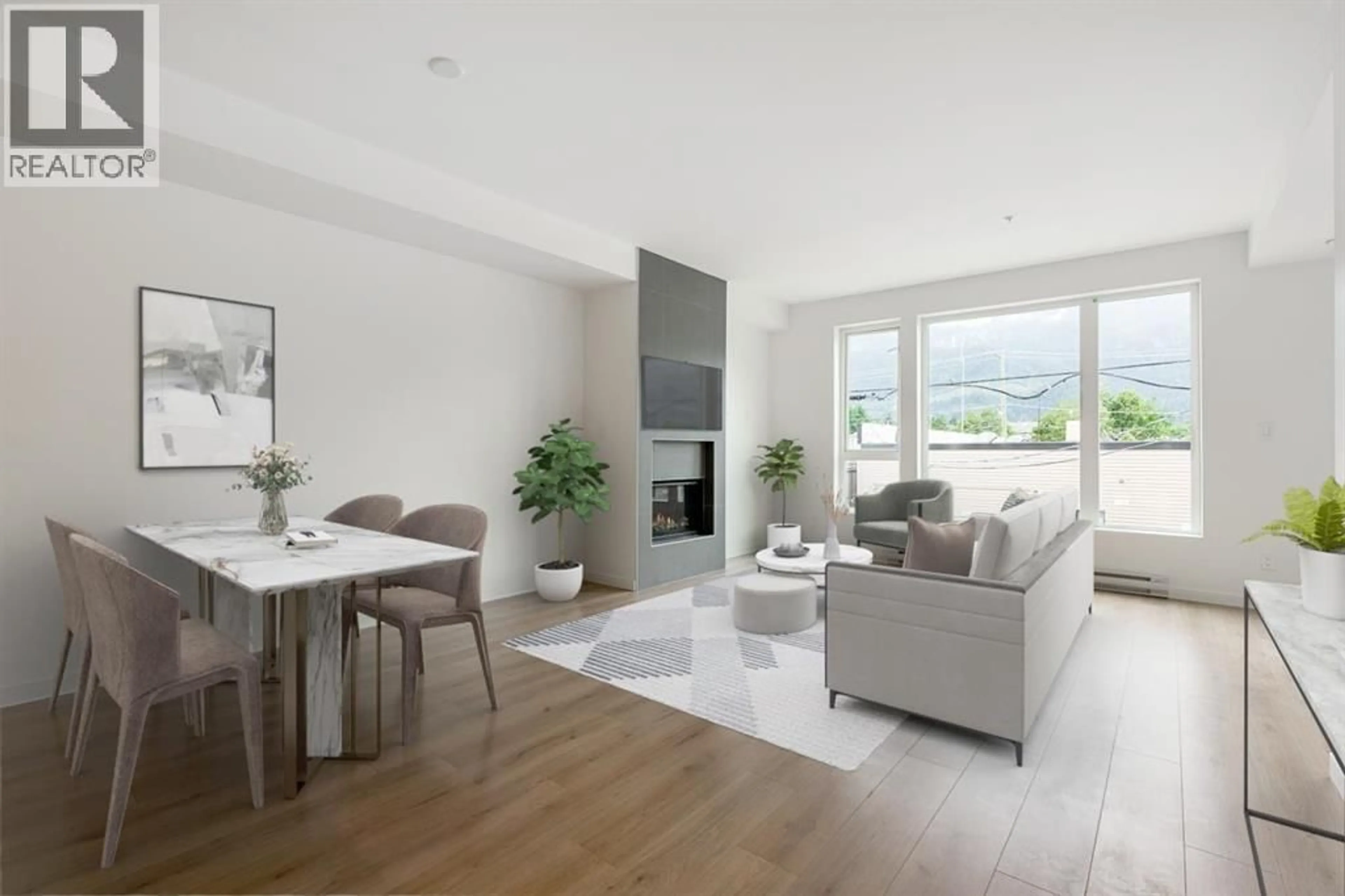 Living room with furniture, wood/laminate floor for 201 - 38165 CLEVELAND AVENUE, Squamish British Columbia V8P0P1