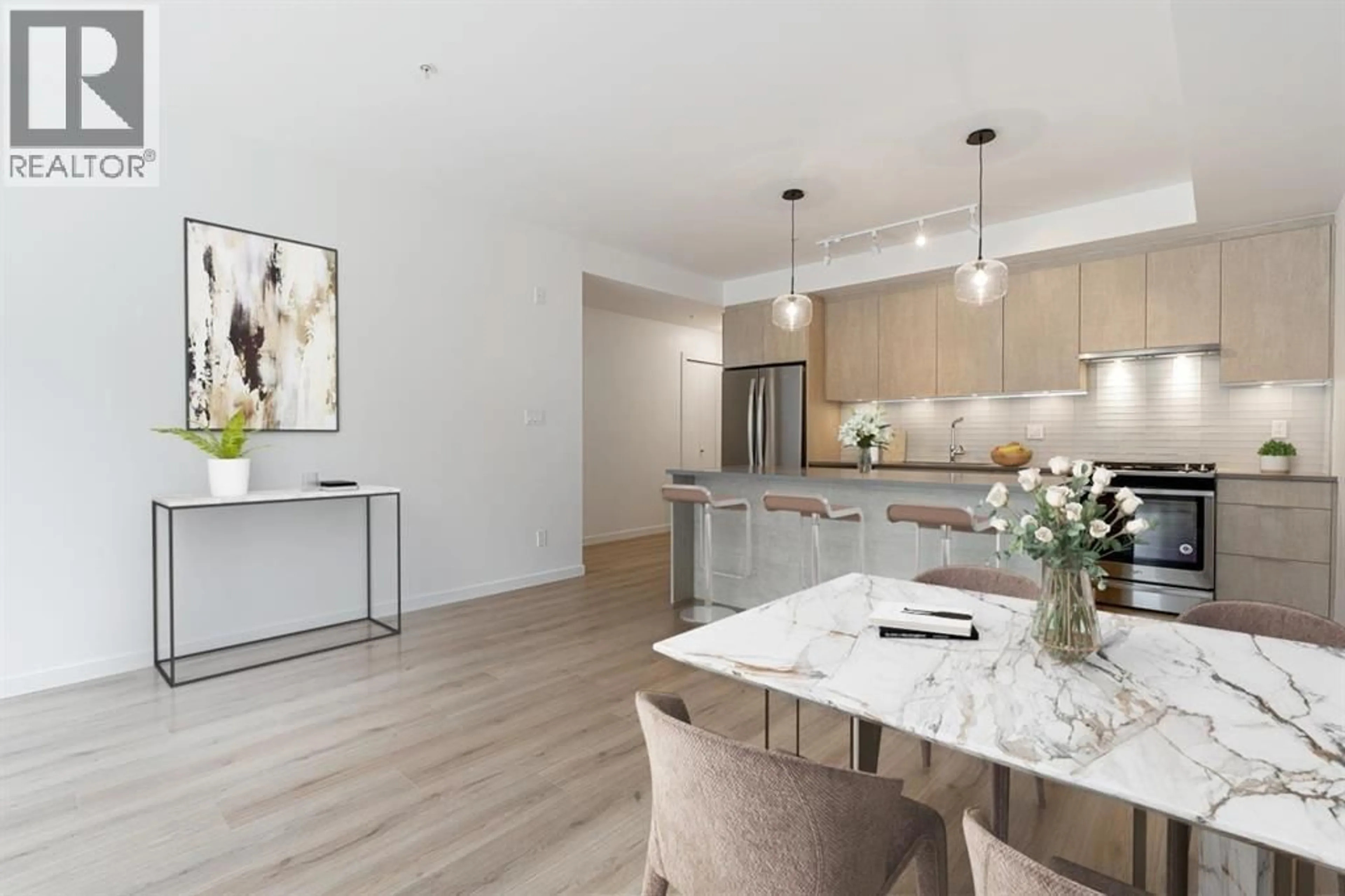 Open concept kitchen, wood/laminate floor for 201 - 38165 CLEVELAND AVENUE, Squamish British Columbia V8P0P1