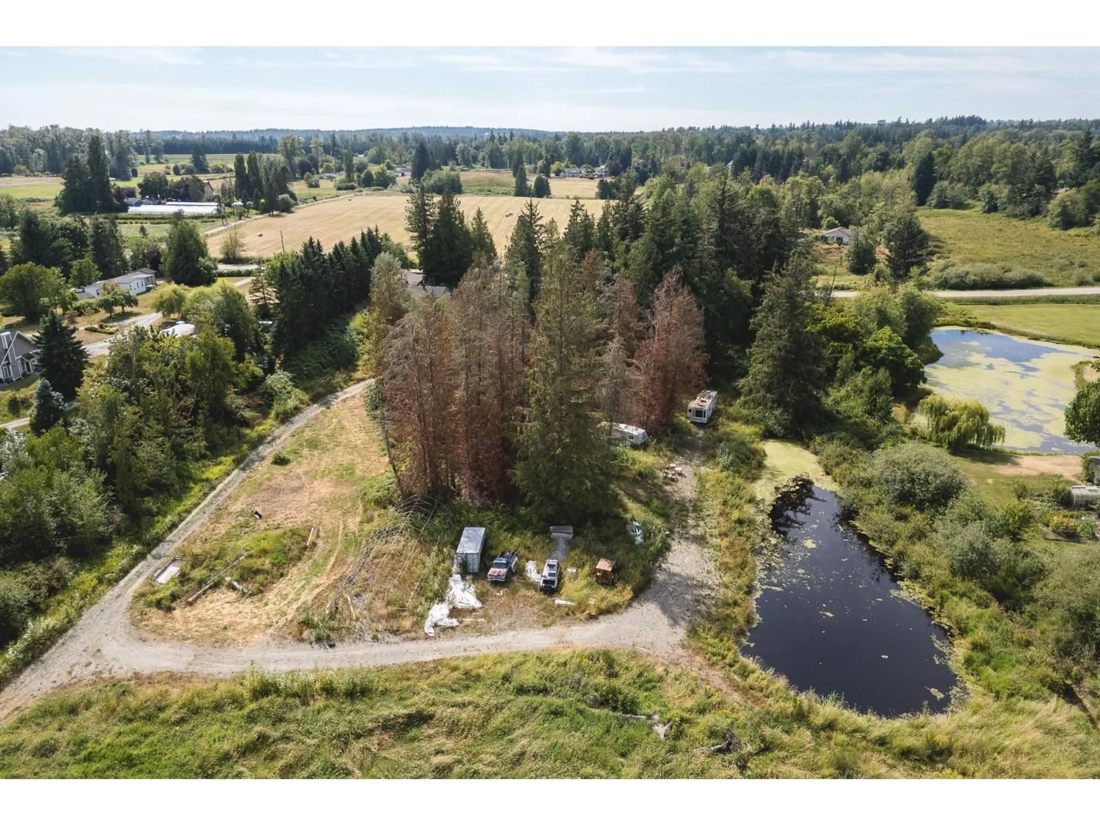 A pic from outside/outdoor area/front of a property/back of a property/a pic from drone, water/lake/river/ocean view for 488 240 STREET, Langley British Columbia V2Z2X6
