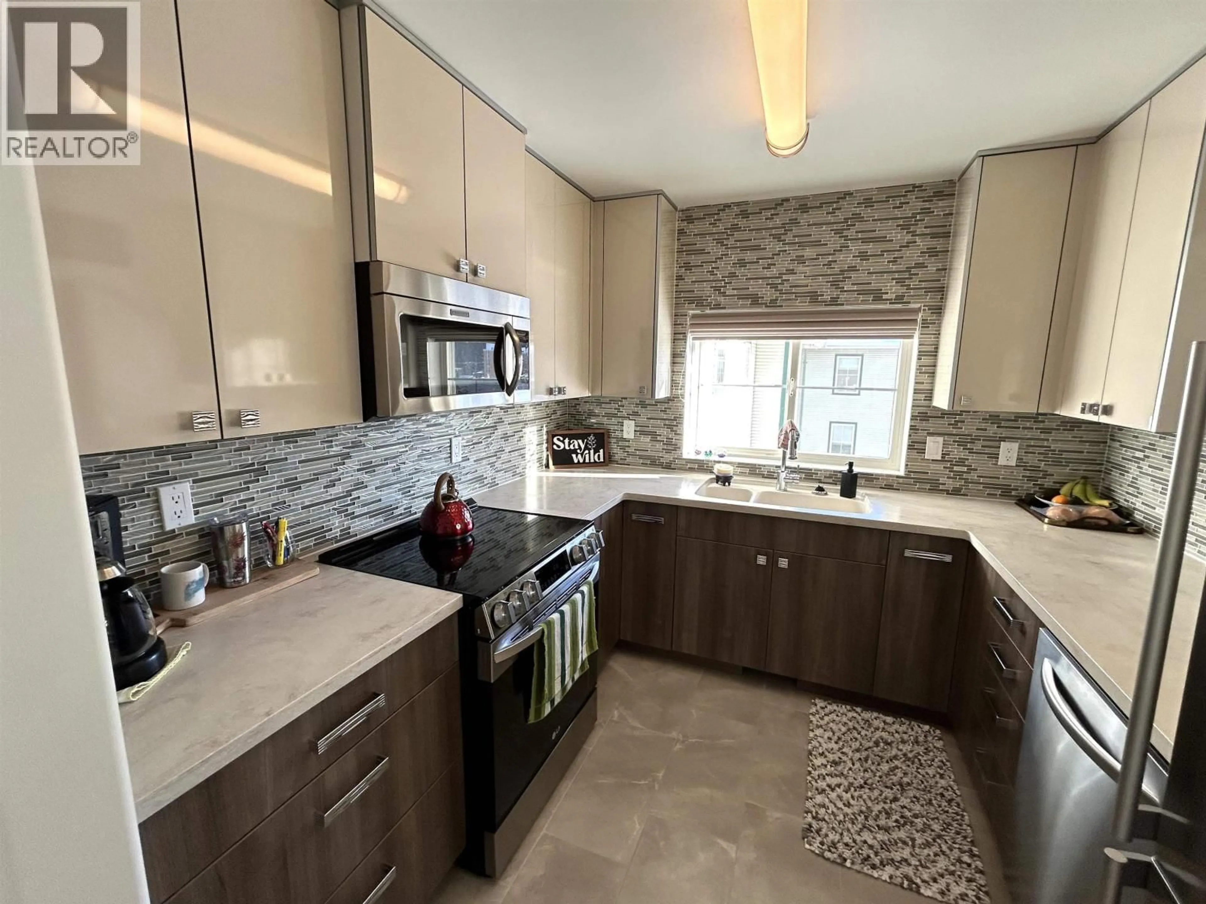 Open concept kitchen, ceramic/tile floor for 407 - 1638 6TH AVENUE, Prince George British Columbia V2L3N6