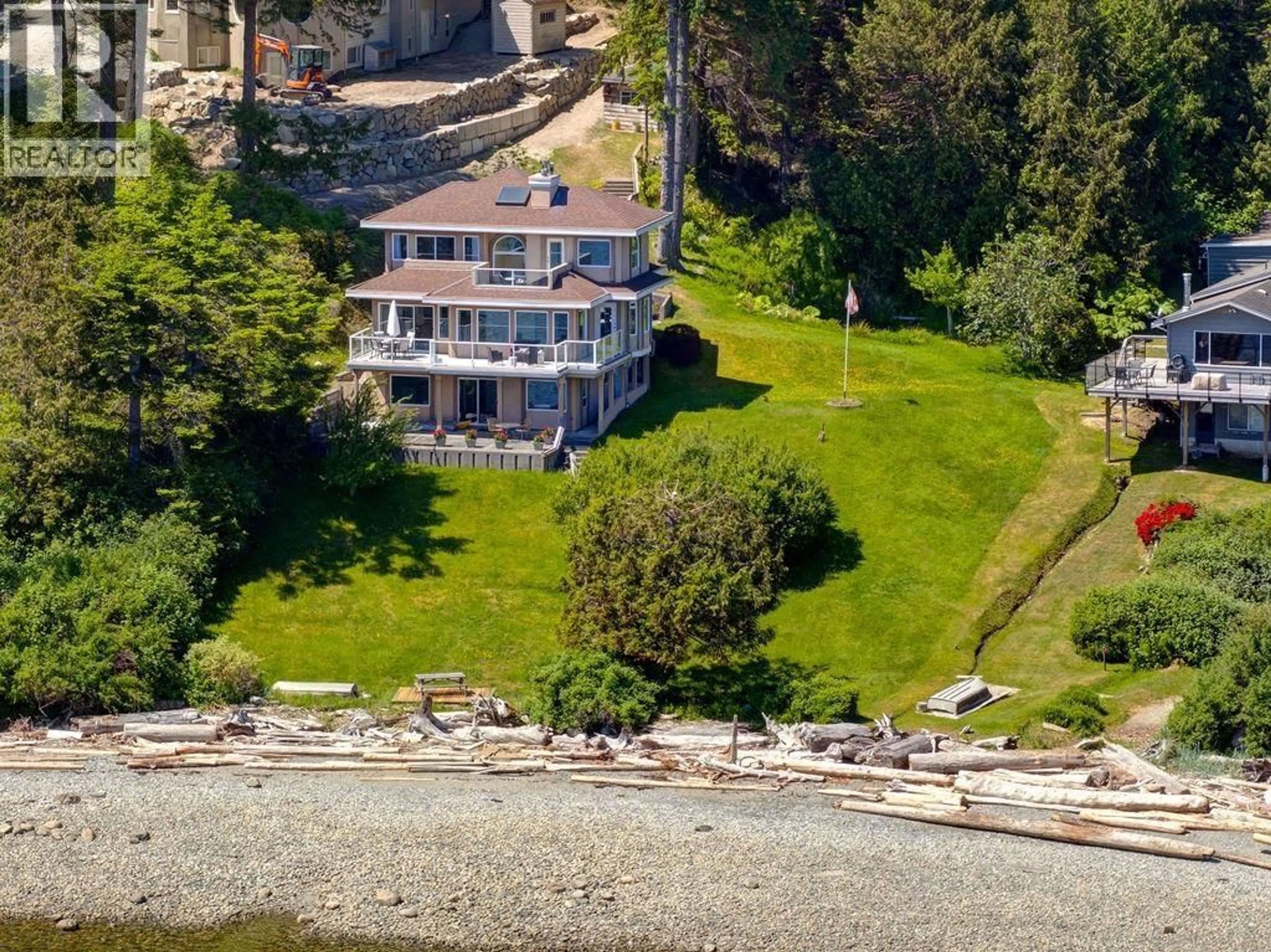 A pic from outside/outdoor area/front of a property/back of a property/a pic from drone, water/lake/river/ocean view for 7659 REDROOFFS ROAD, Halfmoon Bay British Columbia V7Z1C4