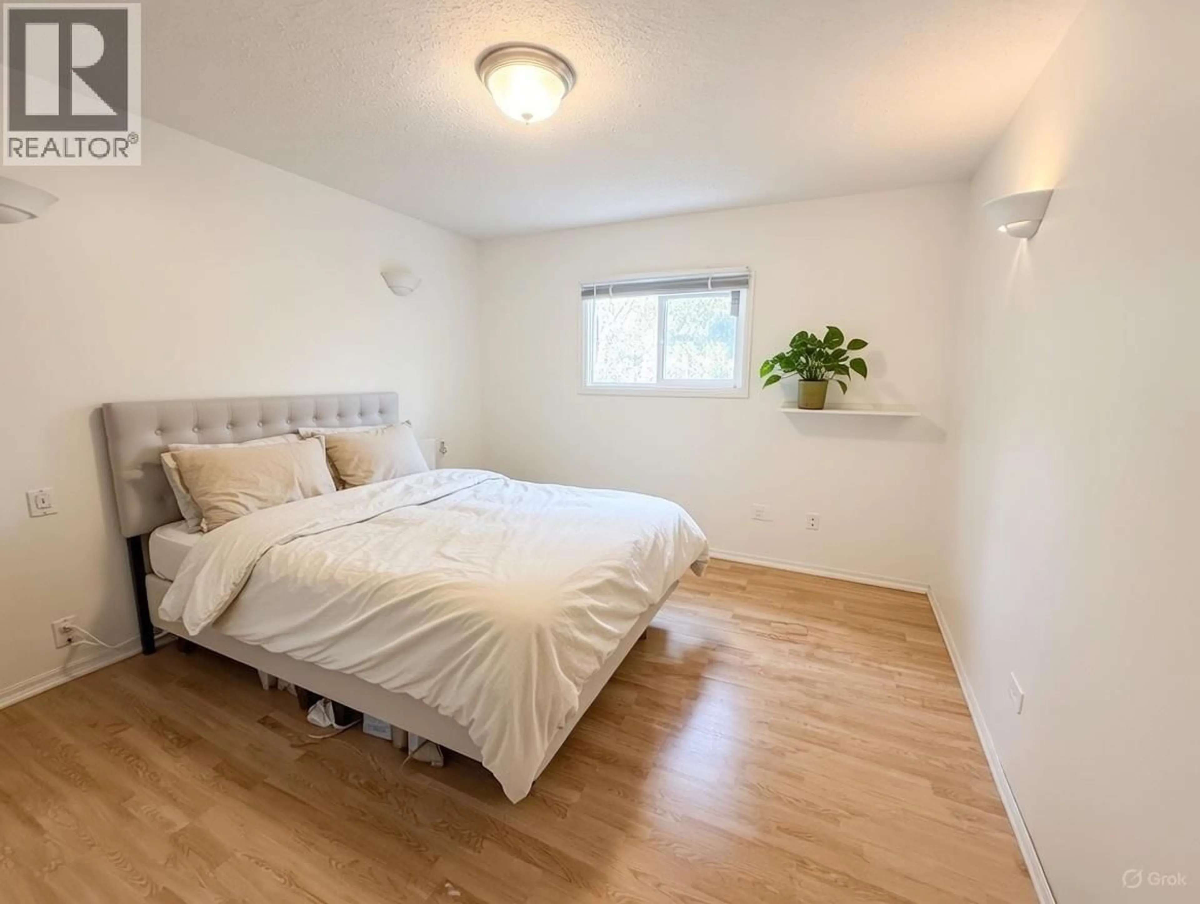 Bedroom with bed, wood/laminate floor for 3508 THOMAS STREET, Terrace British Columbia V8G3G8