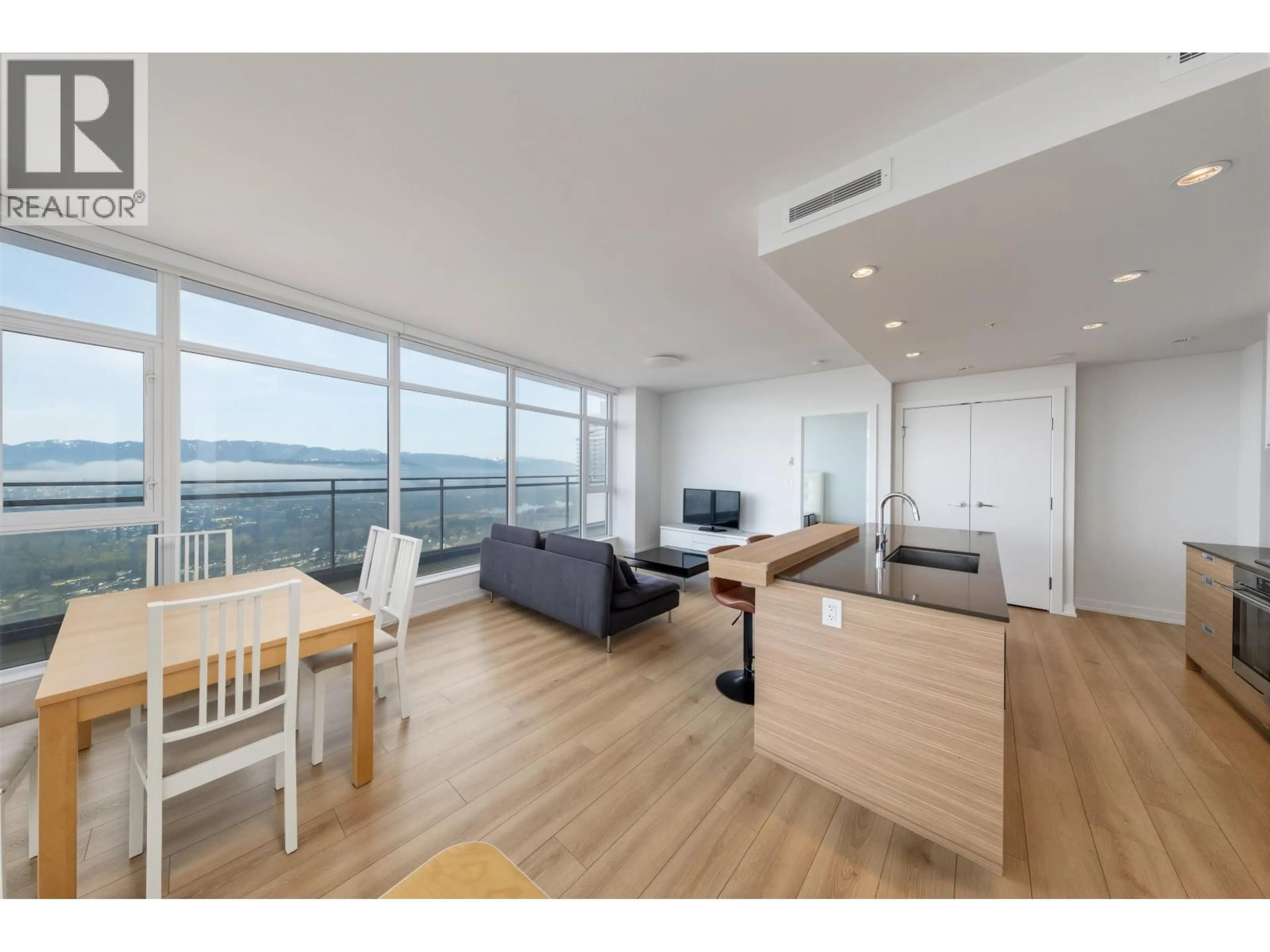 Living room with furniture, wood/laminate floor for 3503 - 4688 KINGSWAY, Burnaby British Columbia V5H0J9