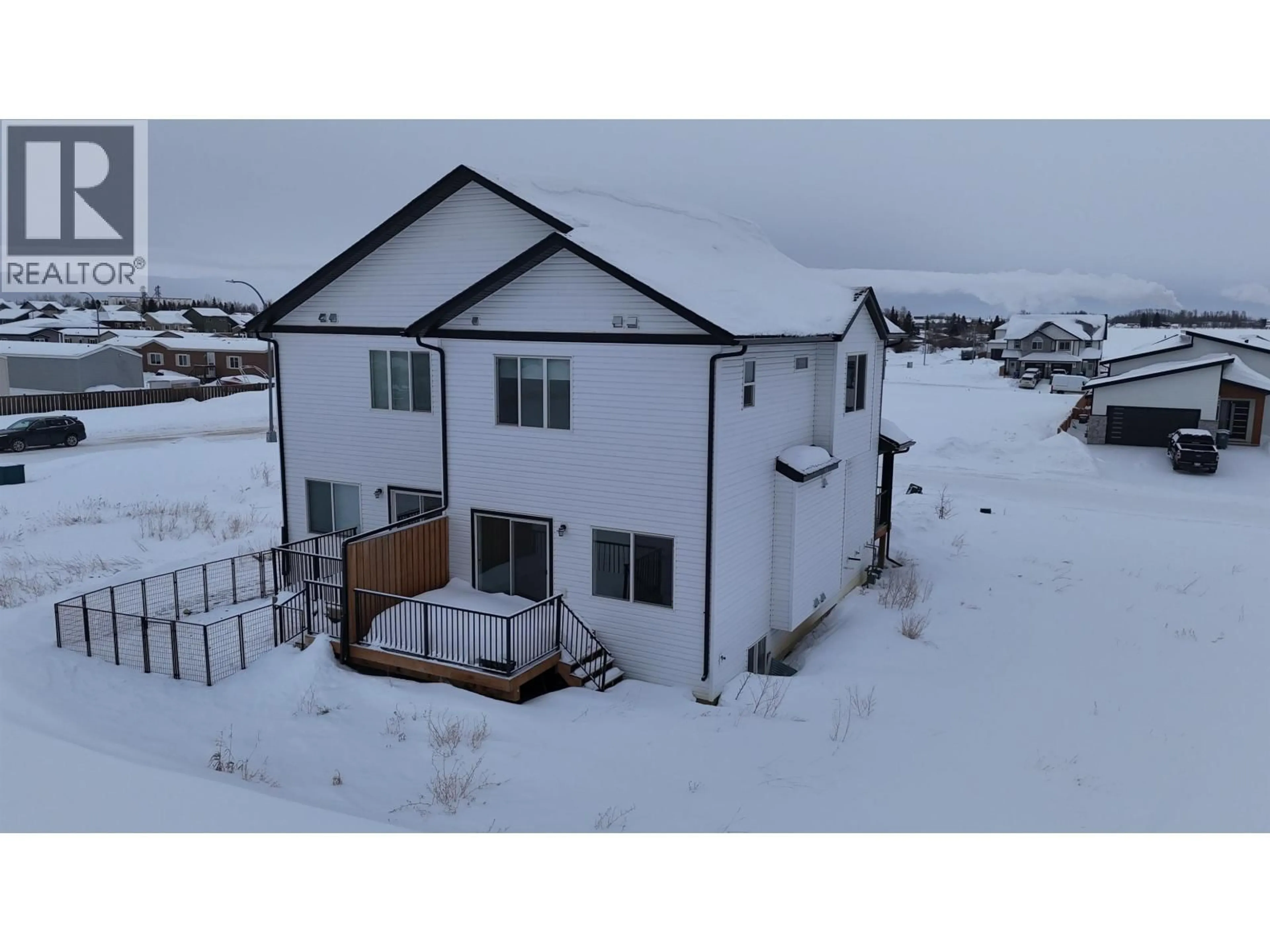 A pic from outside/outdoor area/front of a property/back of a property/a pic from drone, building for 8424 81A STREET, Fort St. John British Columbia V1J0P9
