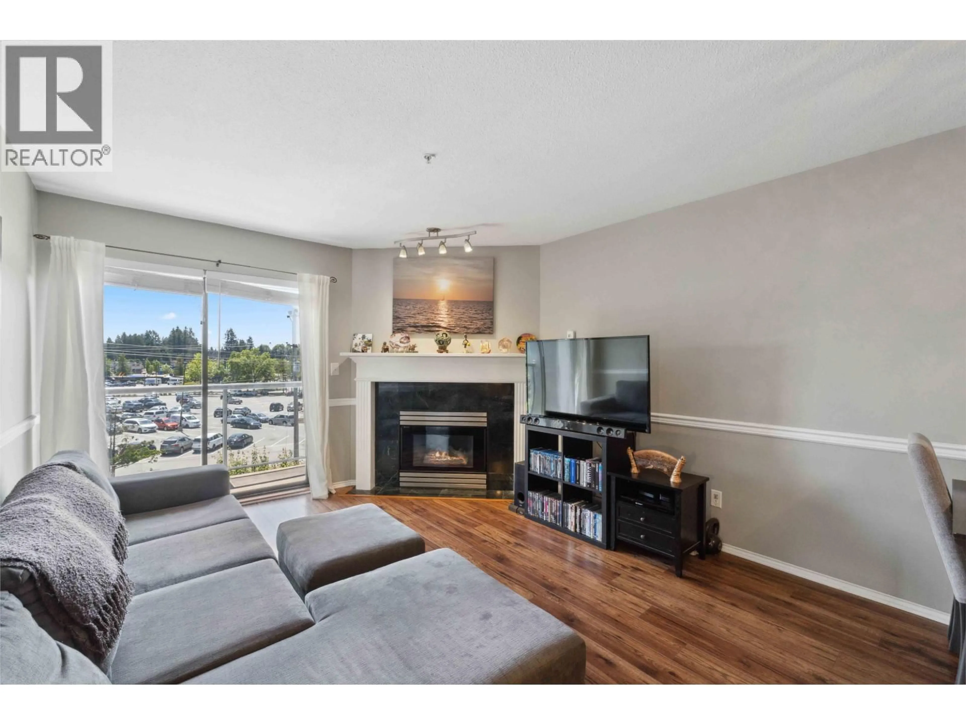 Living room with furniture, wood/laminate floor for 402 - 12025 207A STREET, Maple Ridge British Columbia V2X0R3