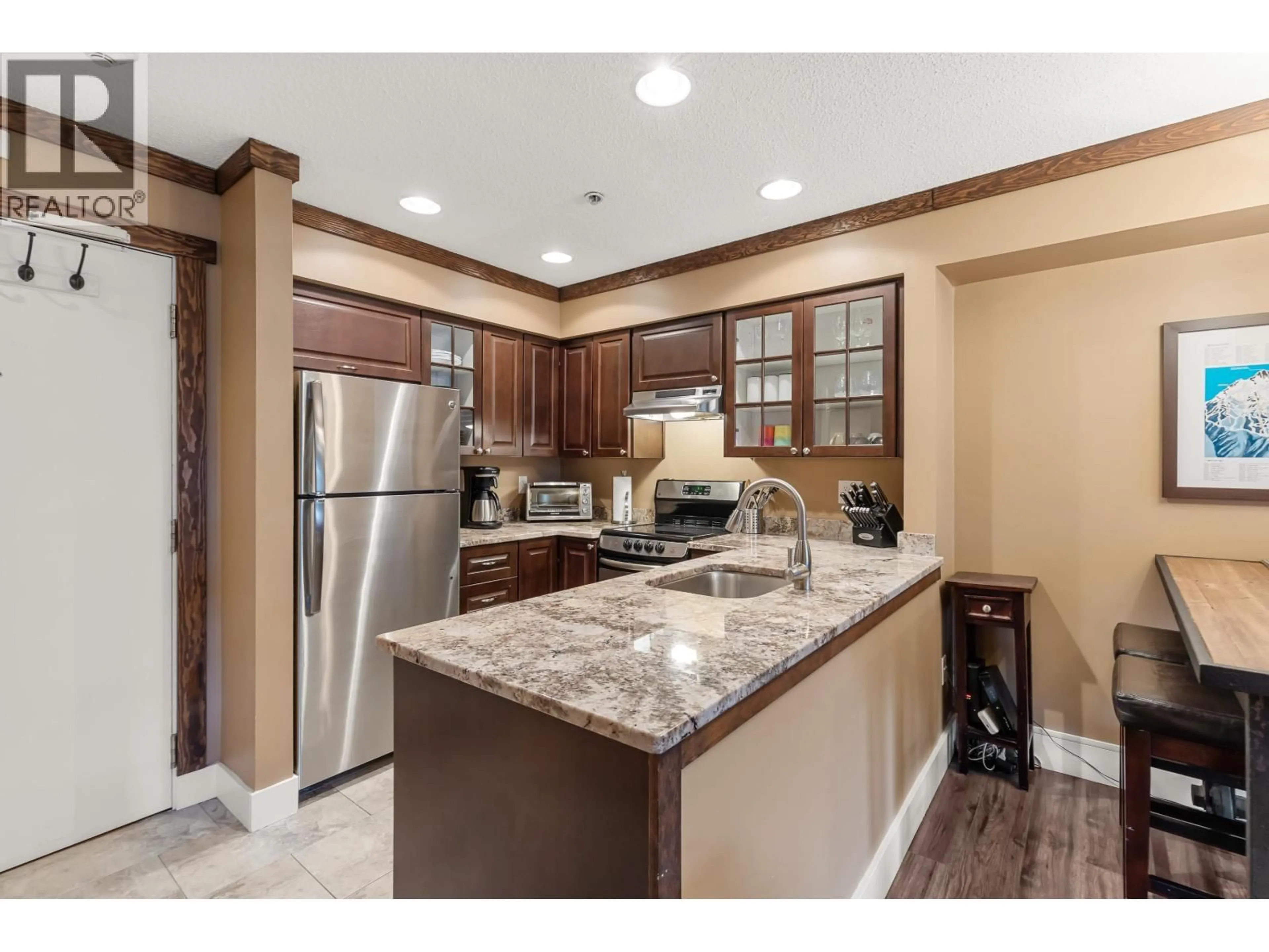 Open concept kitchen, ceramic/tile floor for 207 - 2050 LAKE PLACID ROAD, Whistler British Columbia V8E0A8