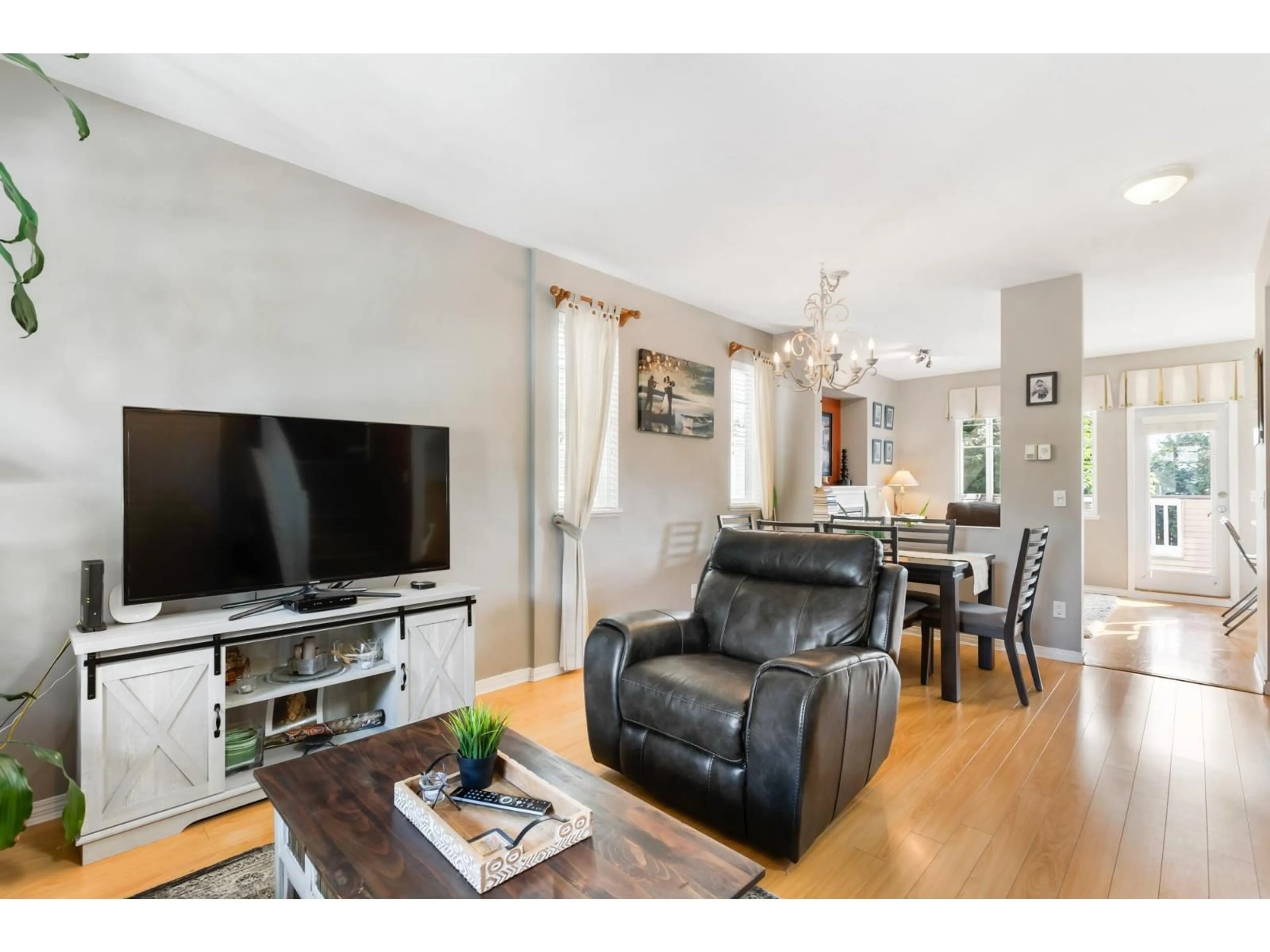 Living room with furniture, wood/laminate floor for 14876 56A AVENUE, Surrey British Columbia V3S8X1