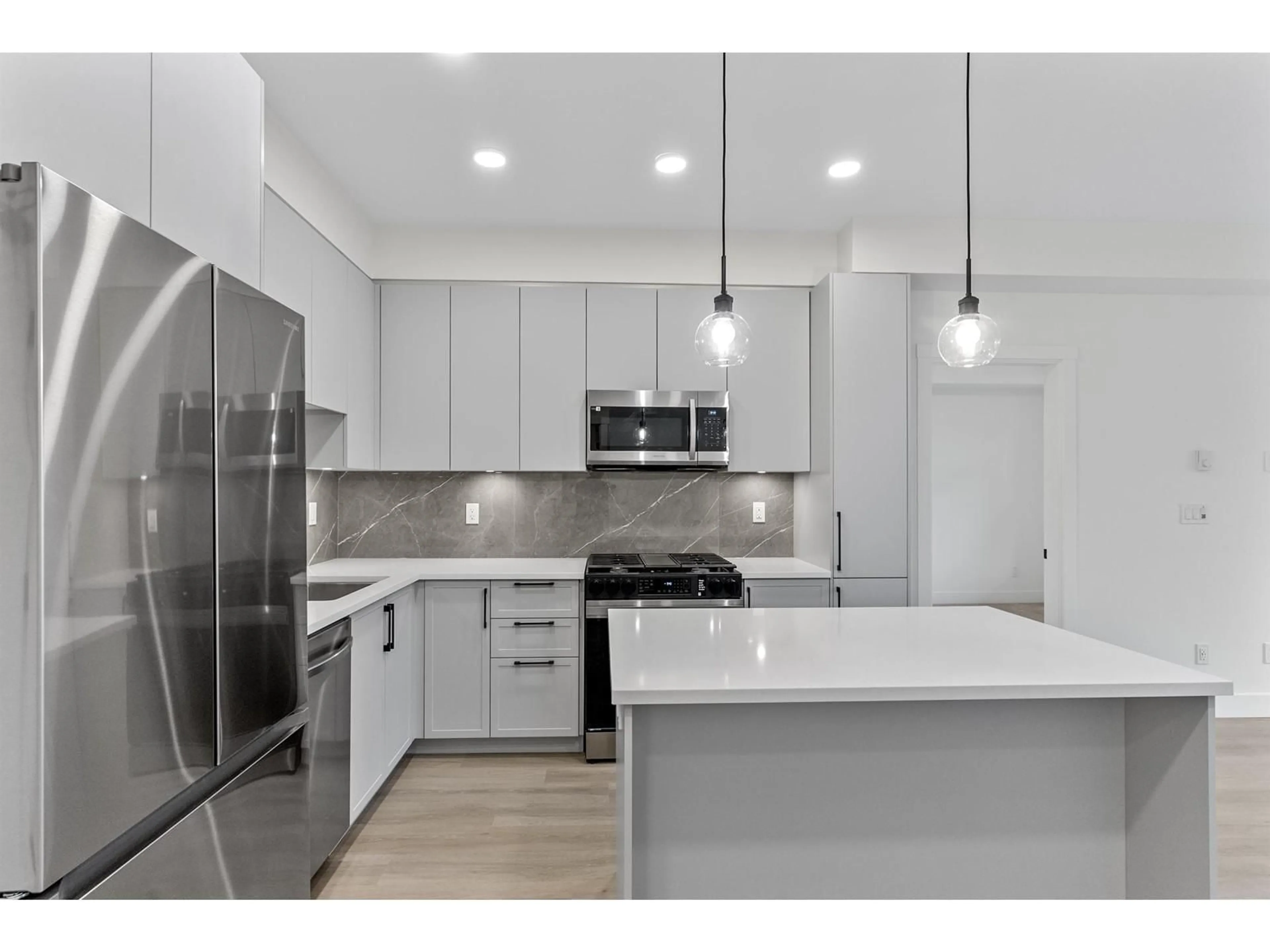 Open concept kitchen, unknown for 615 - 3528 146A STREET, Surrey British Columbia V4P0H4